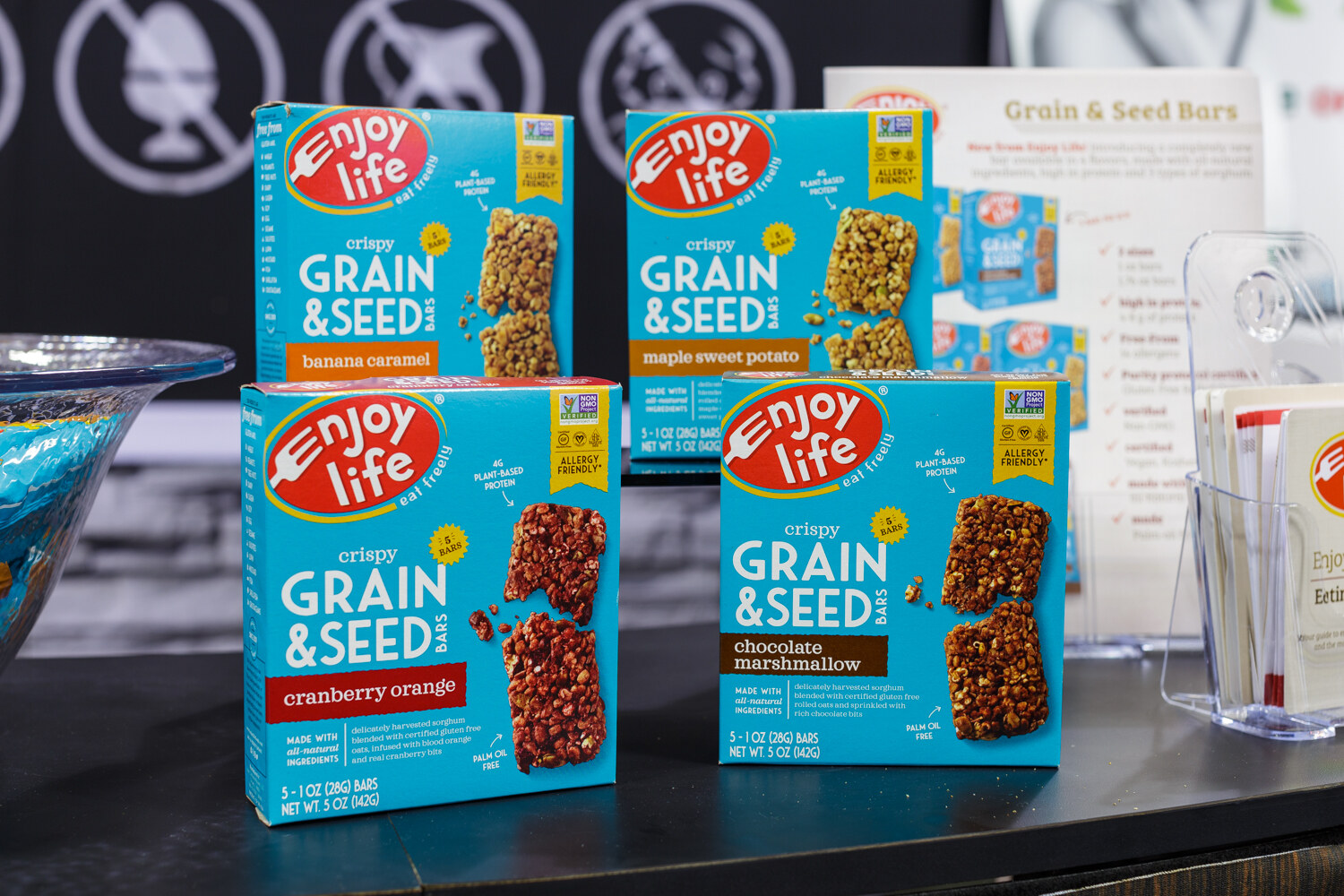 Boxes of snack bars on a booth display.