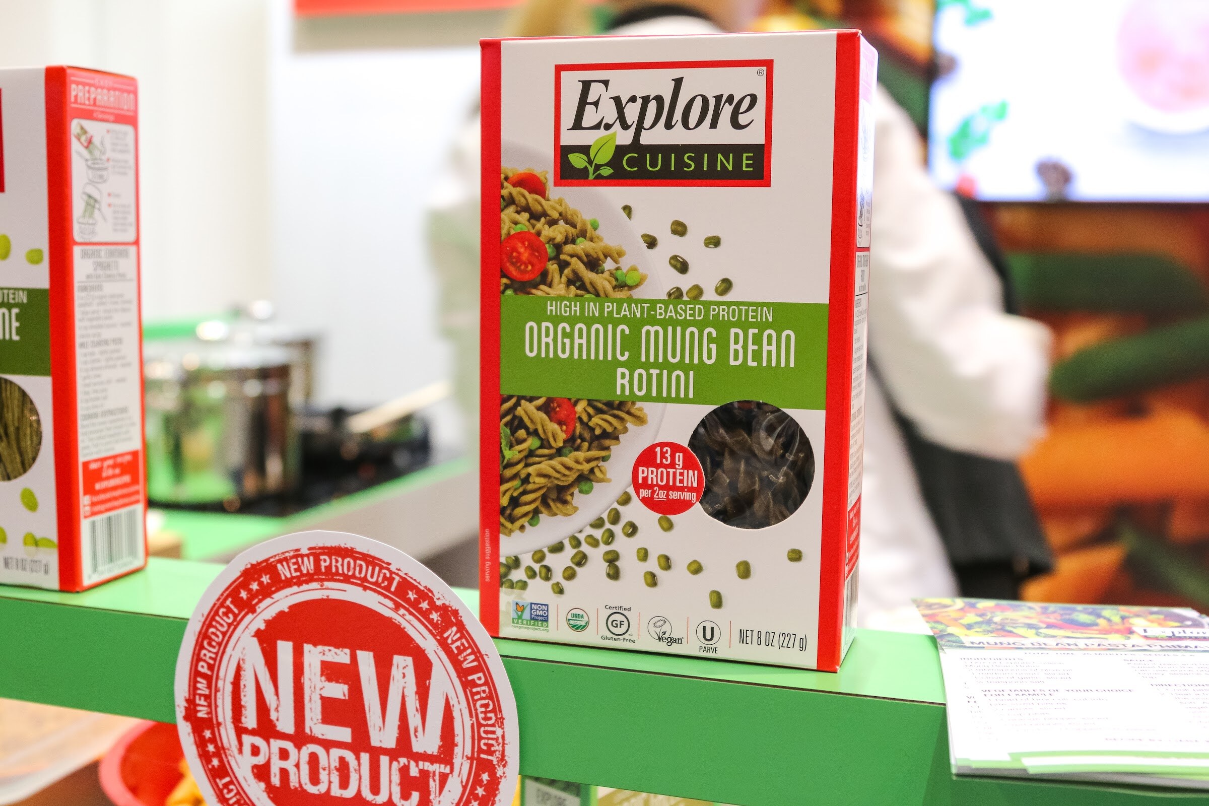 Packages of mung bean pasta and bowls of sample dishes.