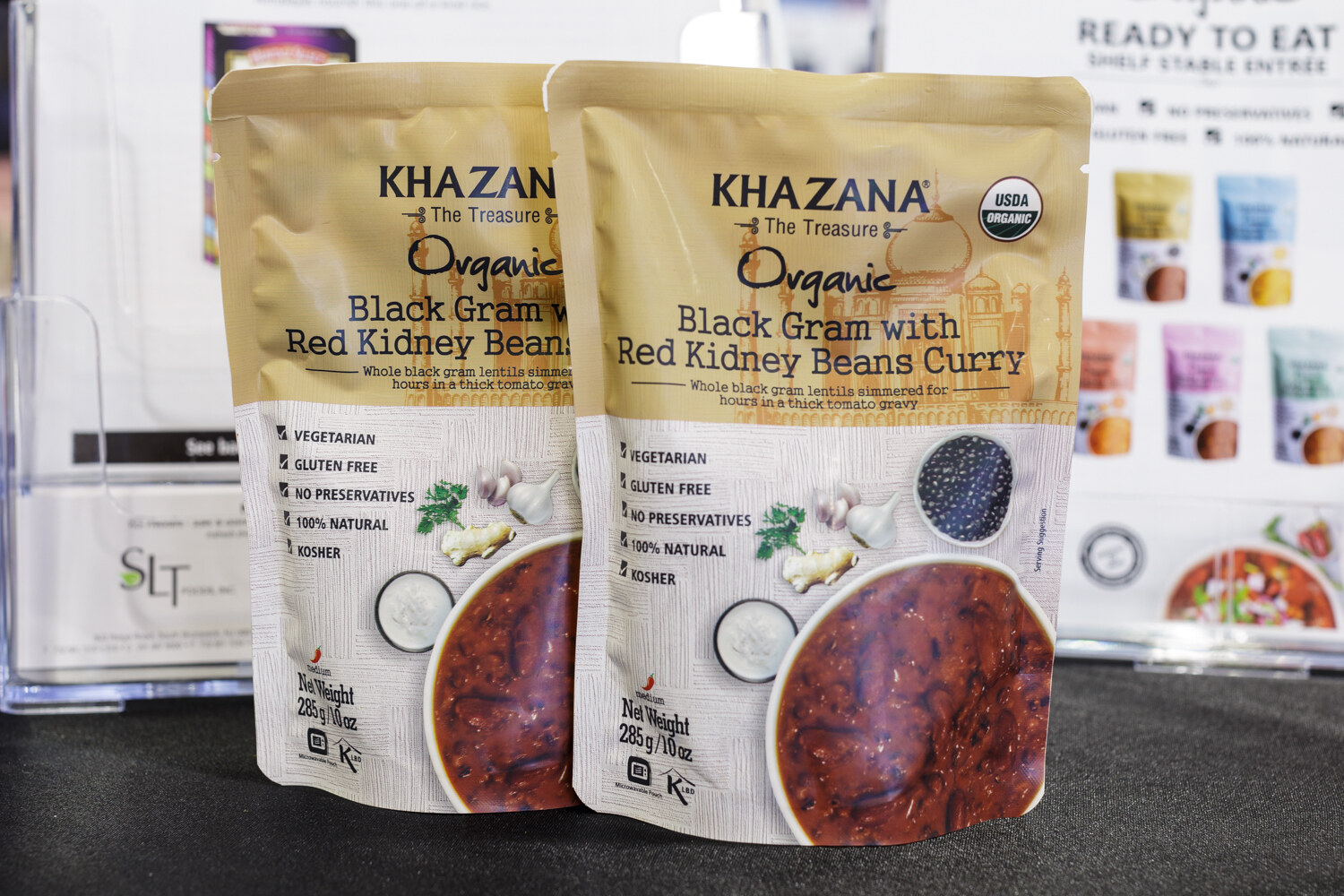 Two pouches of Khazana organic black gram with red kidney beans curry.