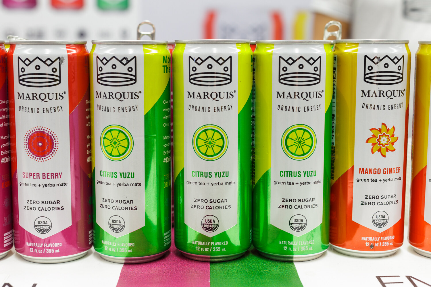 Colorful cans of energy drinks lined up.