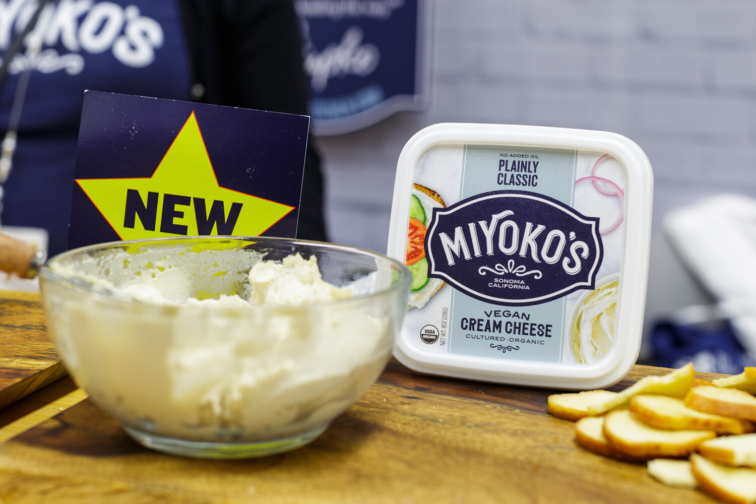 A bowl of cream cheese beside a package labeled Miyoko's.