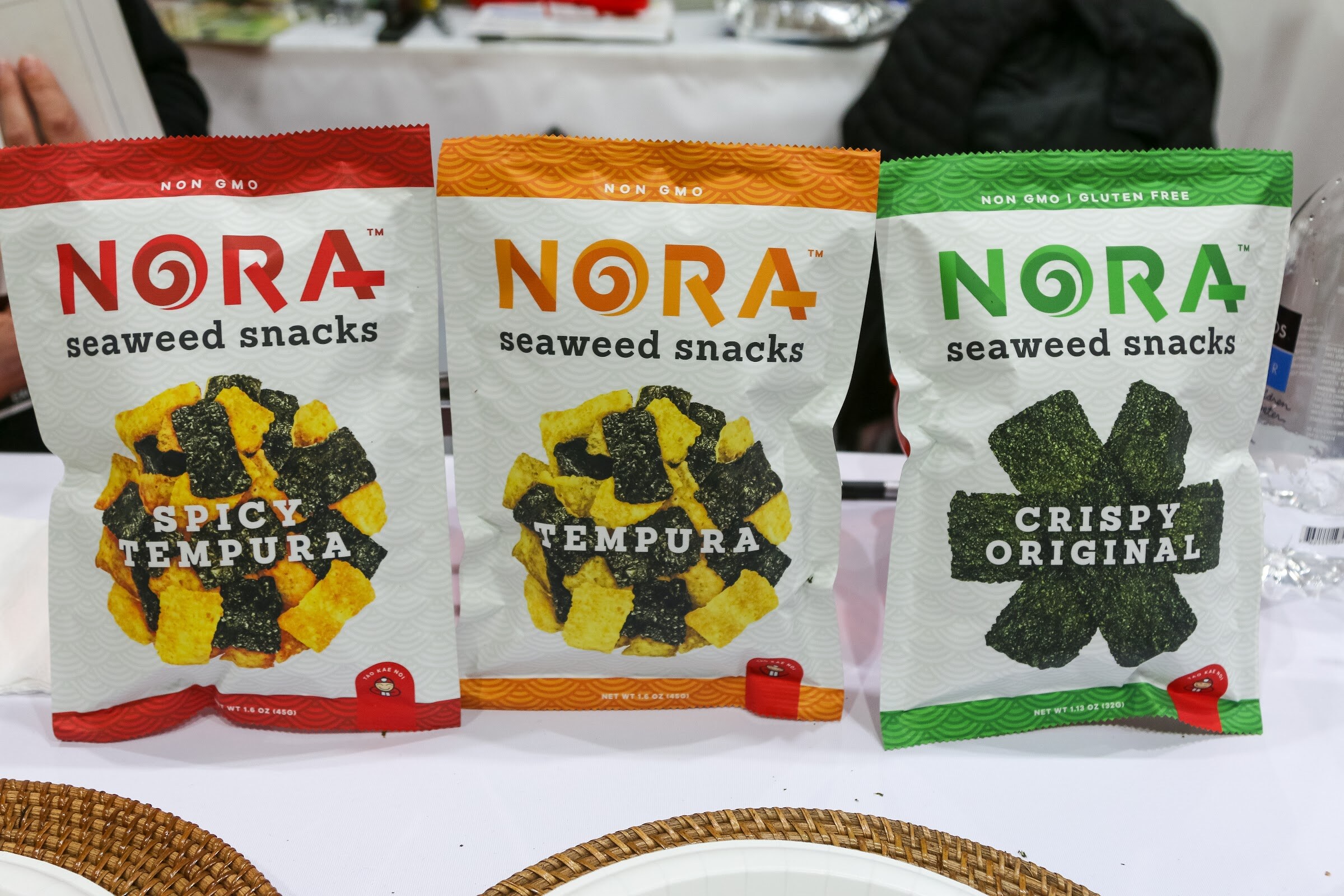 Three bags of Nora seaweed snacks in spicy tempura, tempura and crispy original.