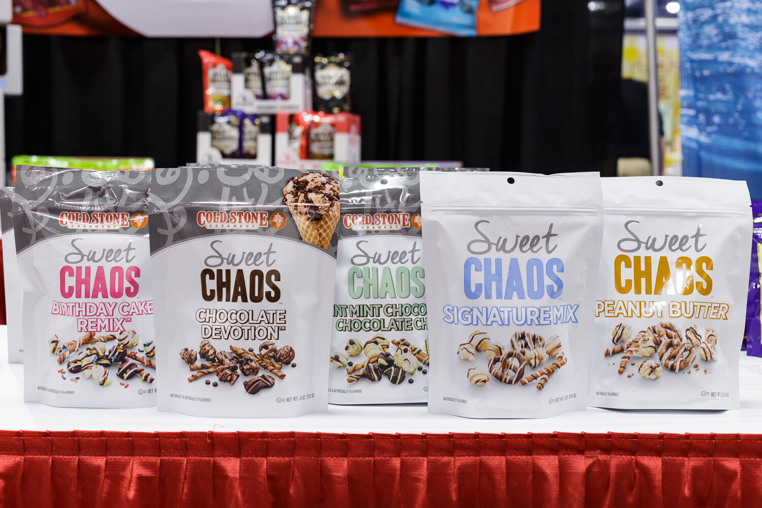 Bags of Sweet Chaos in birthday cake, chocolate devotion, signature mix and peanut butter flavors.