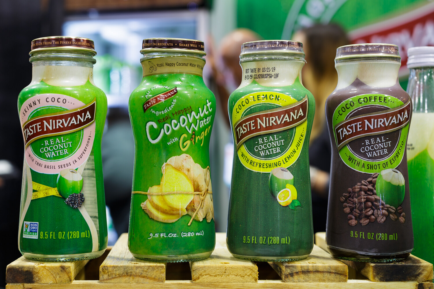 Four bottles of coconut water in different flavors.