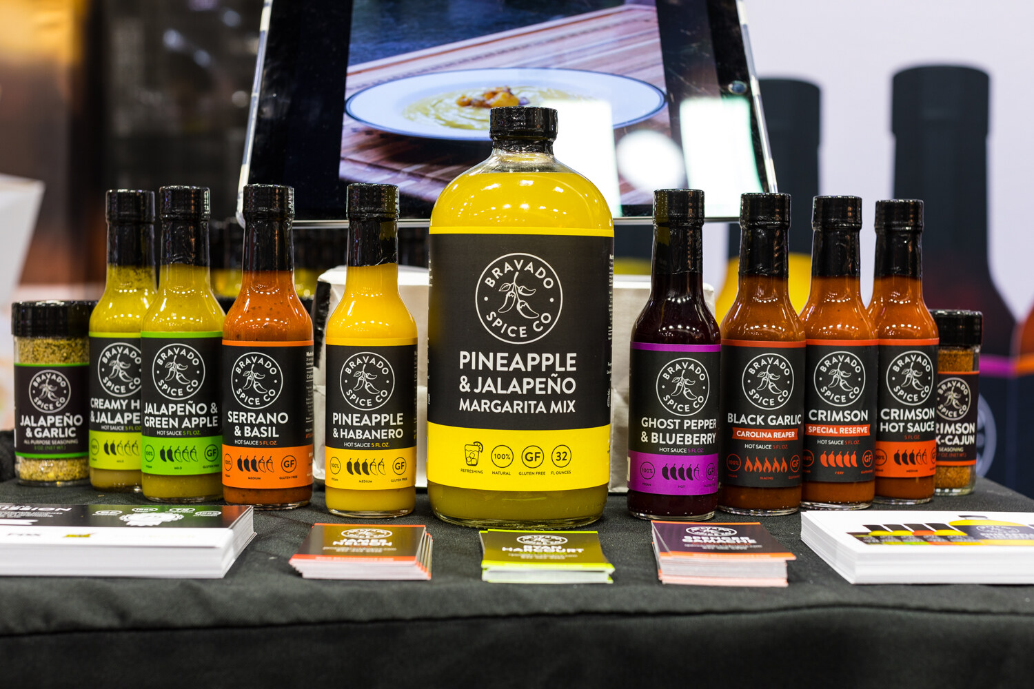 Photo of bottles of Bravado Spice Co. hot sauces and a pineapple jalapeno margarita mix.