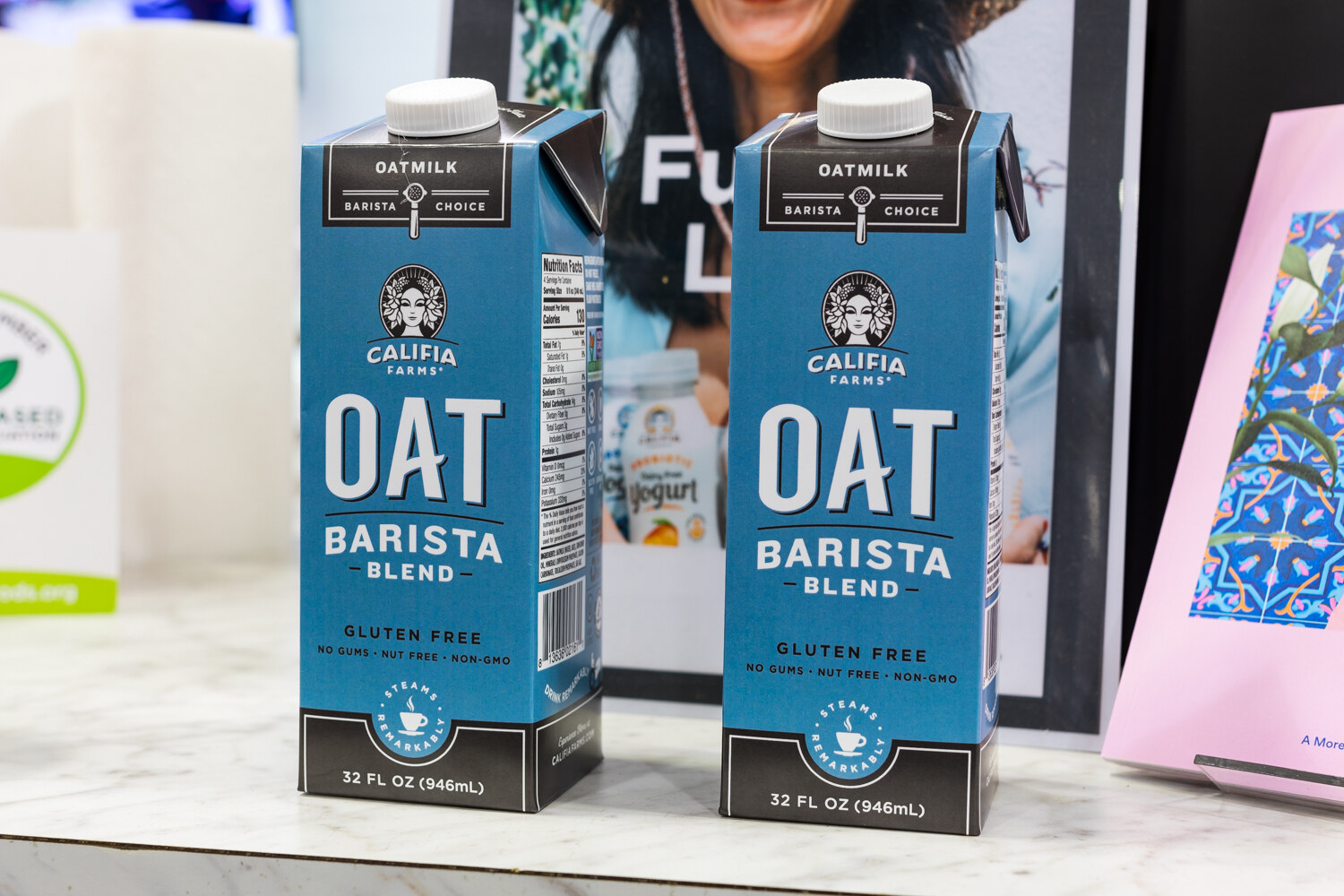 Photo of two cartons of Califia Farms oat barista blend.