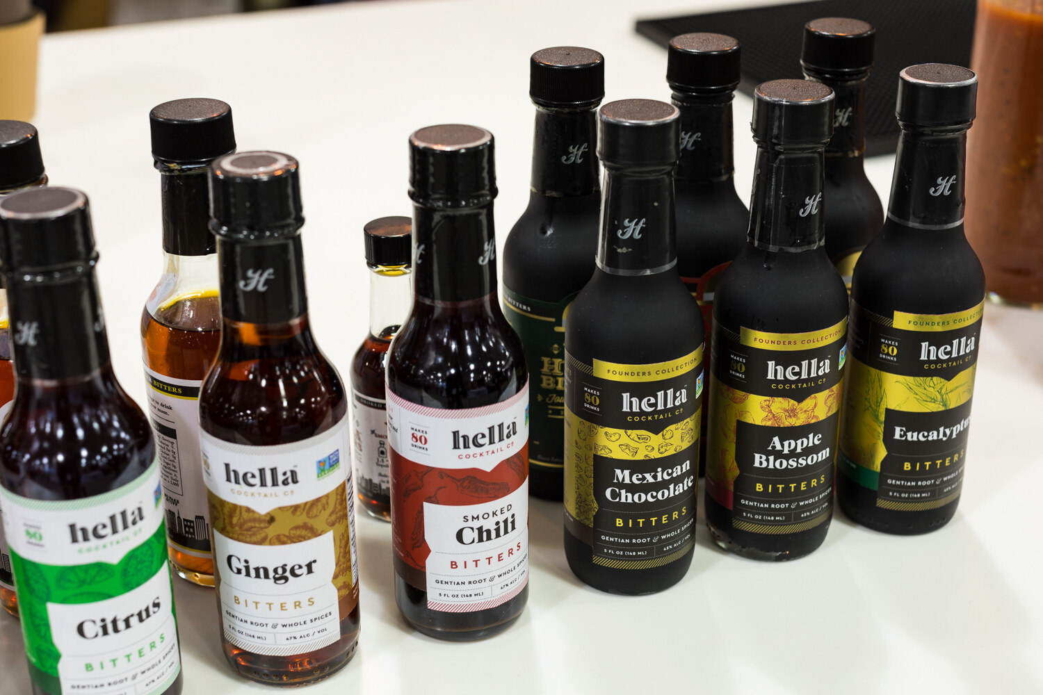 Photo of bottles of hella bitters in citrus, ginger and chili.