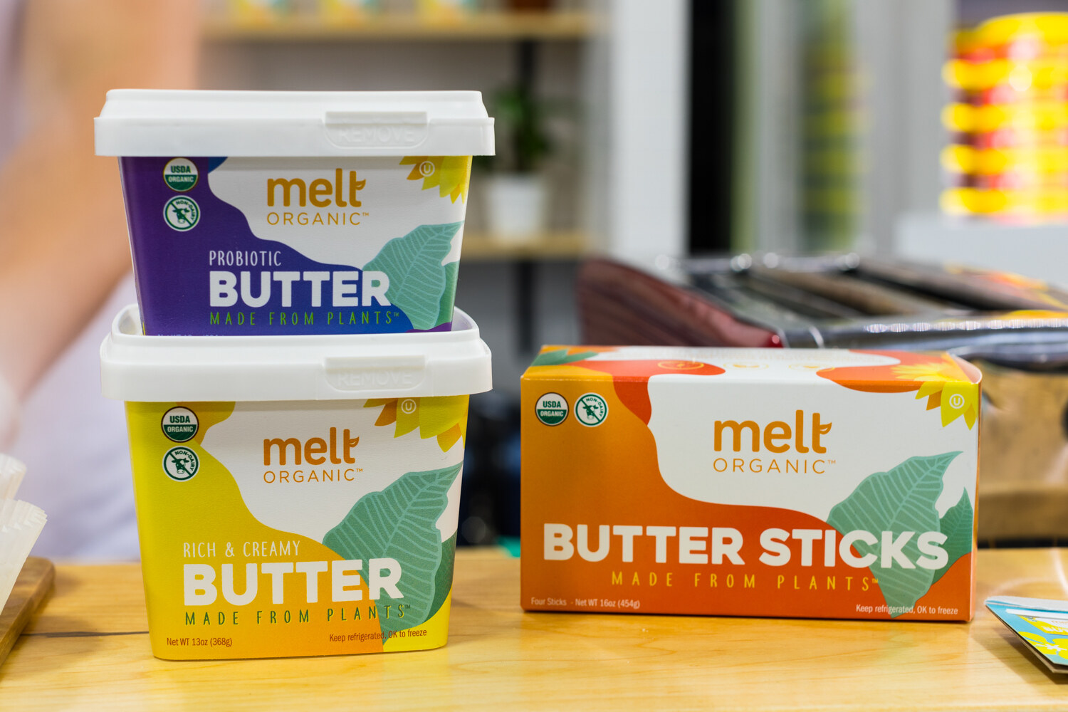 Photo of Melt Organic probiotic butter tubs and butter sticks.