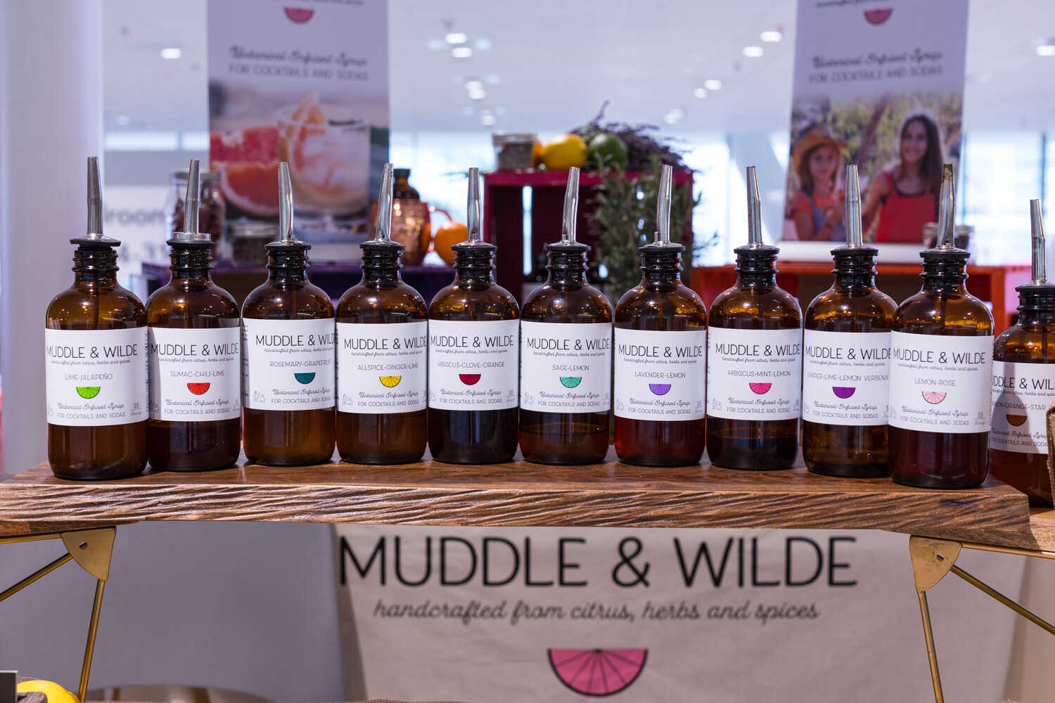 Photo of bottles of Muddle & Wilde cocktail syrups in a row.