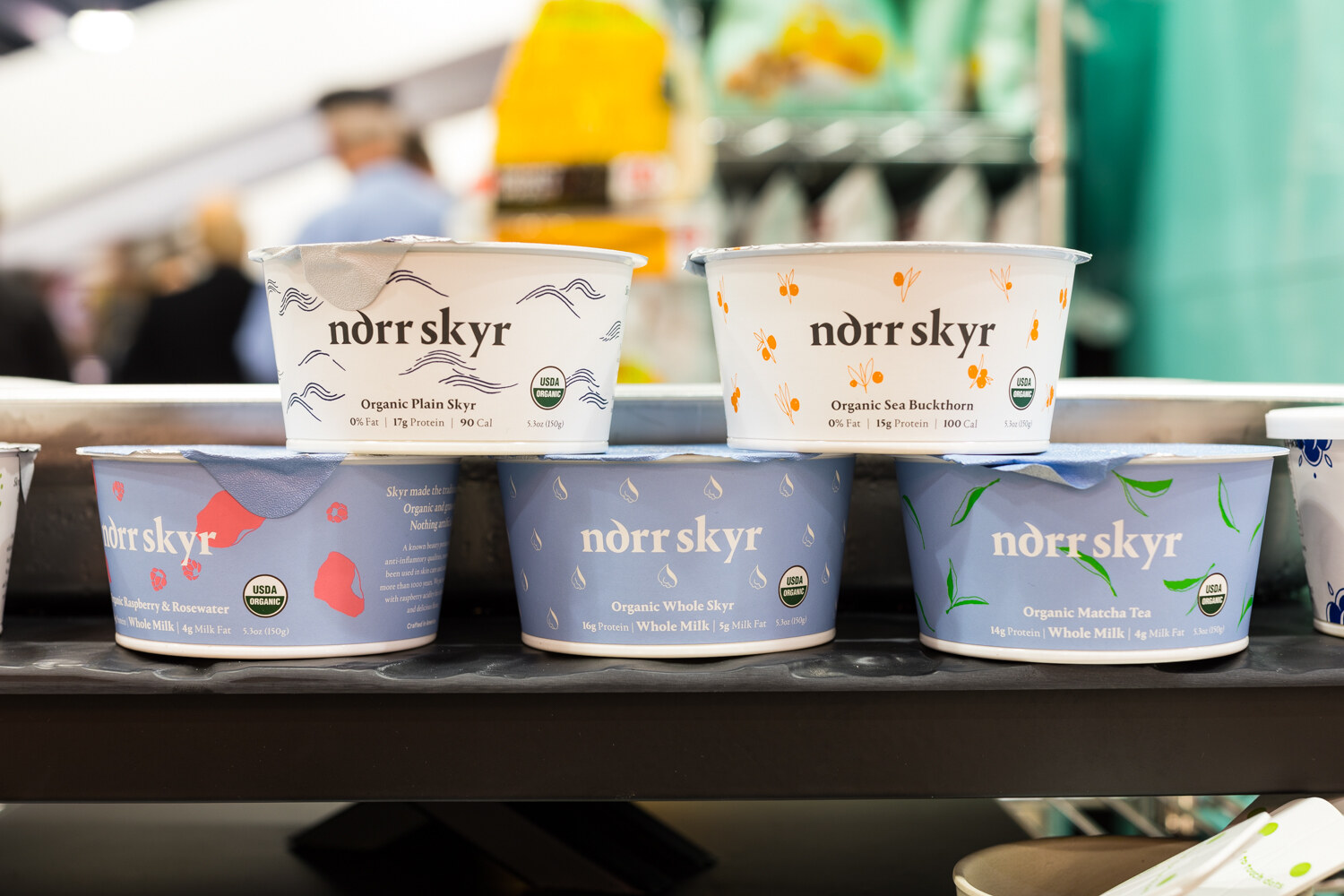 Photo of tubs of Norr Skyr Icelandic-style skyr stacked on a shelf.