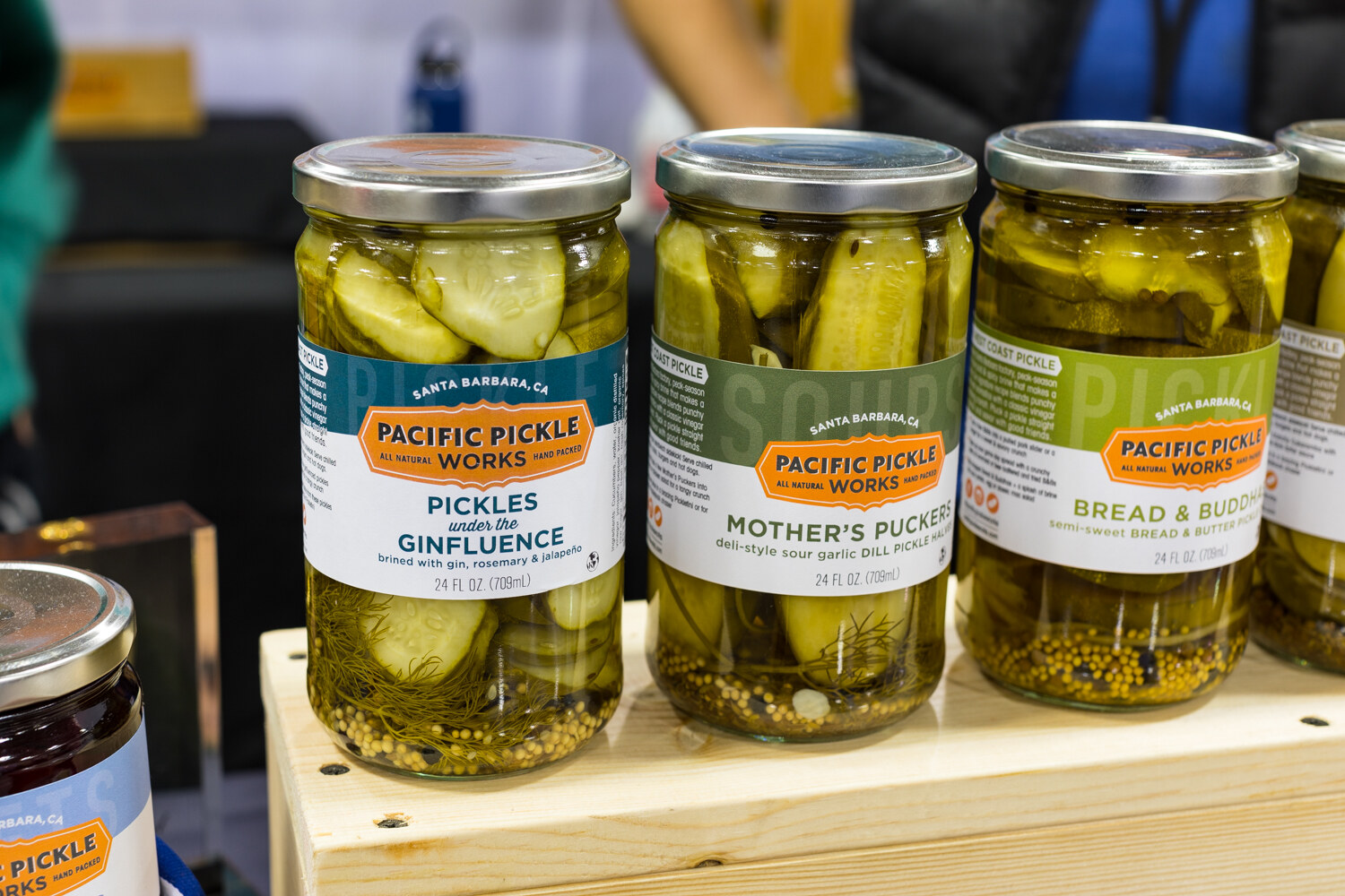 Photo of jars of Pacific Pickle Works pickles in a wooden crate.