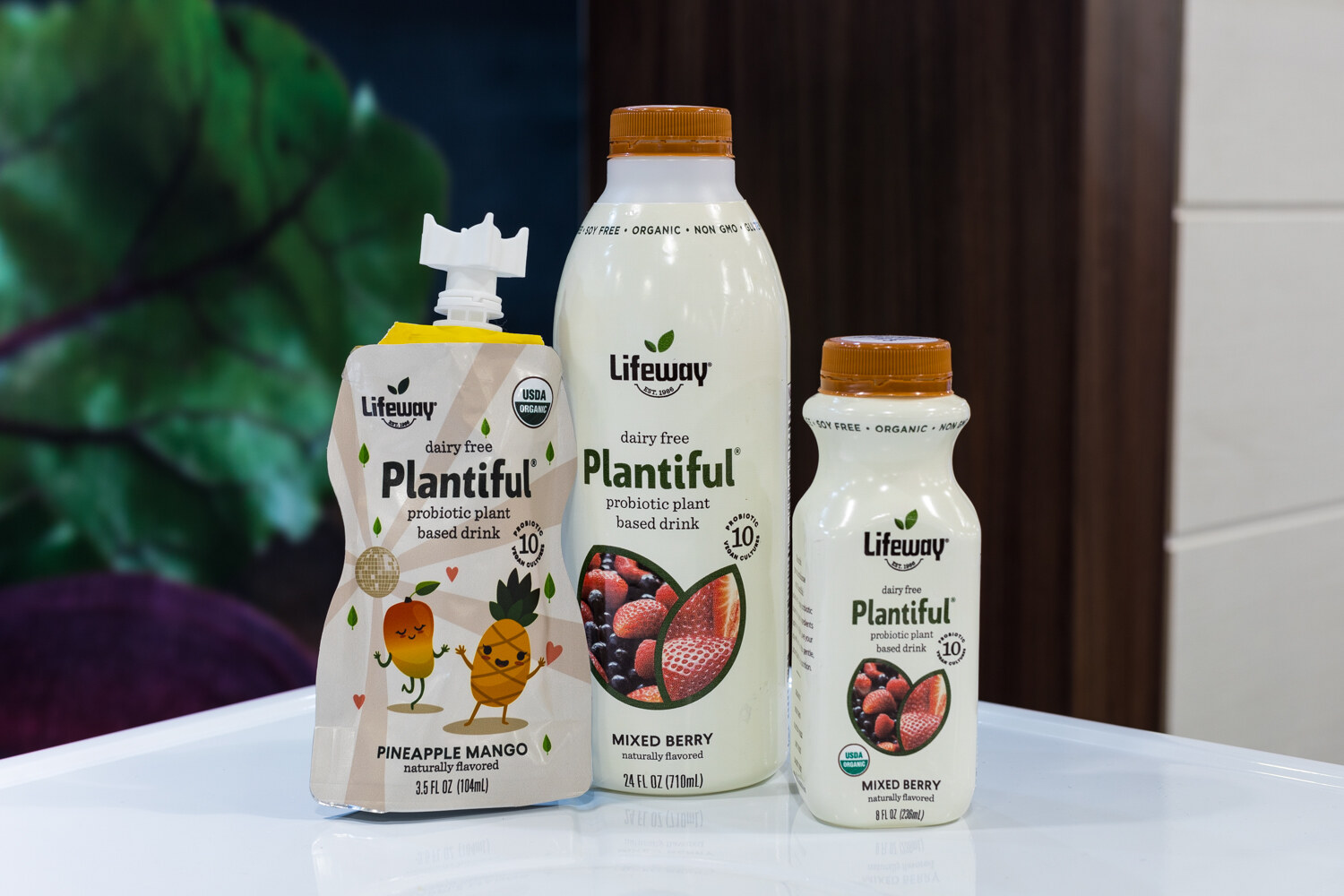 Photo of Lifeway Plantiful pouches and bottles on a white stand.