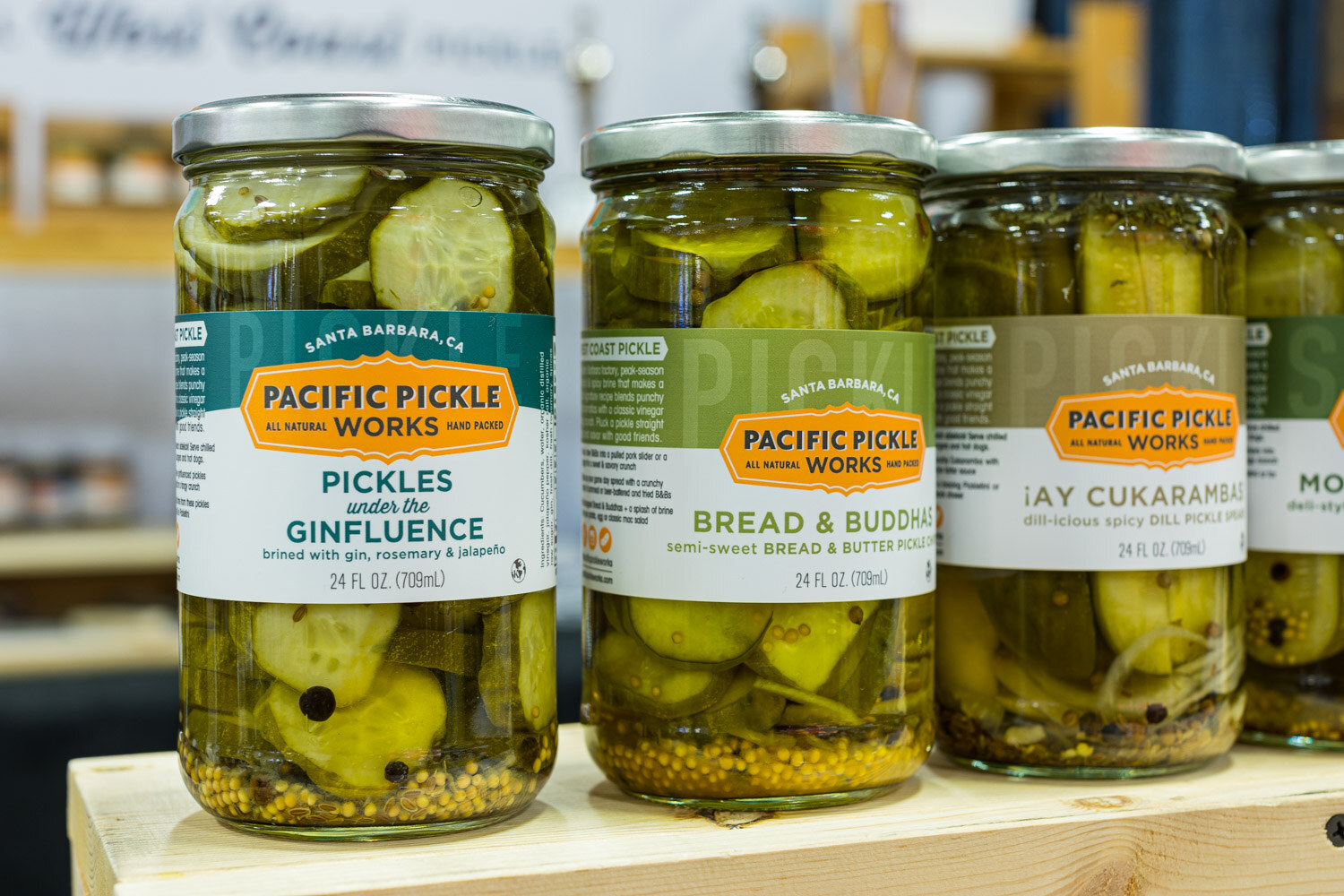 Three jars of Pacific Pickle Works pickles including Pickles under the Ginfluence and Bread and Buddha