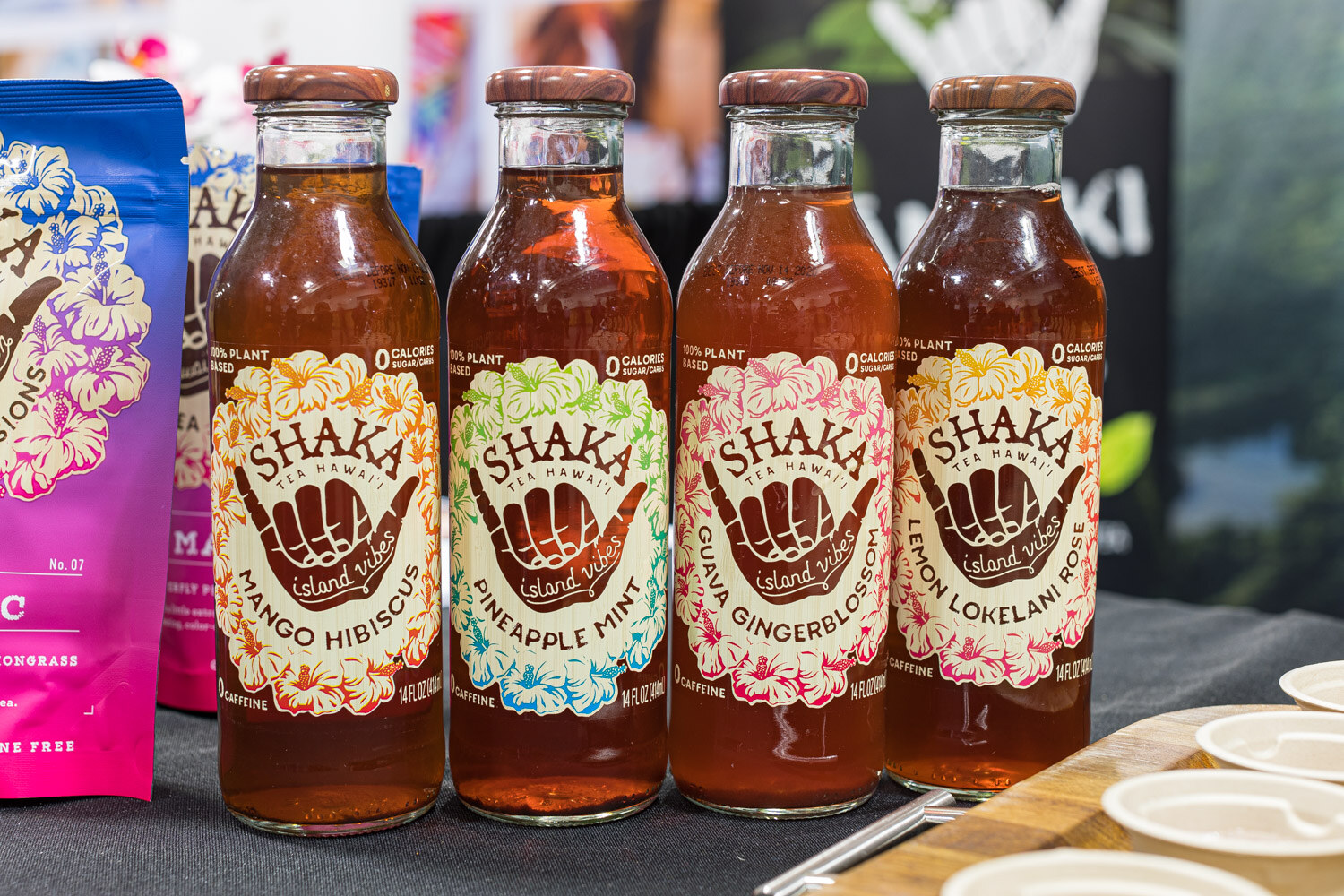 Four Shaka Tea Hawaii bottles in mango hibiscus, pineapple mint, guava gingerblossom and lemon lokelani rose
