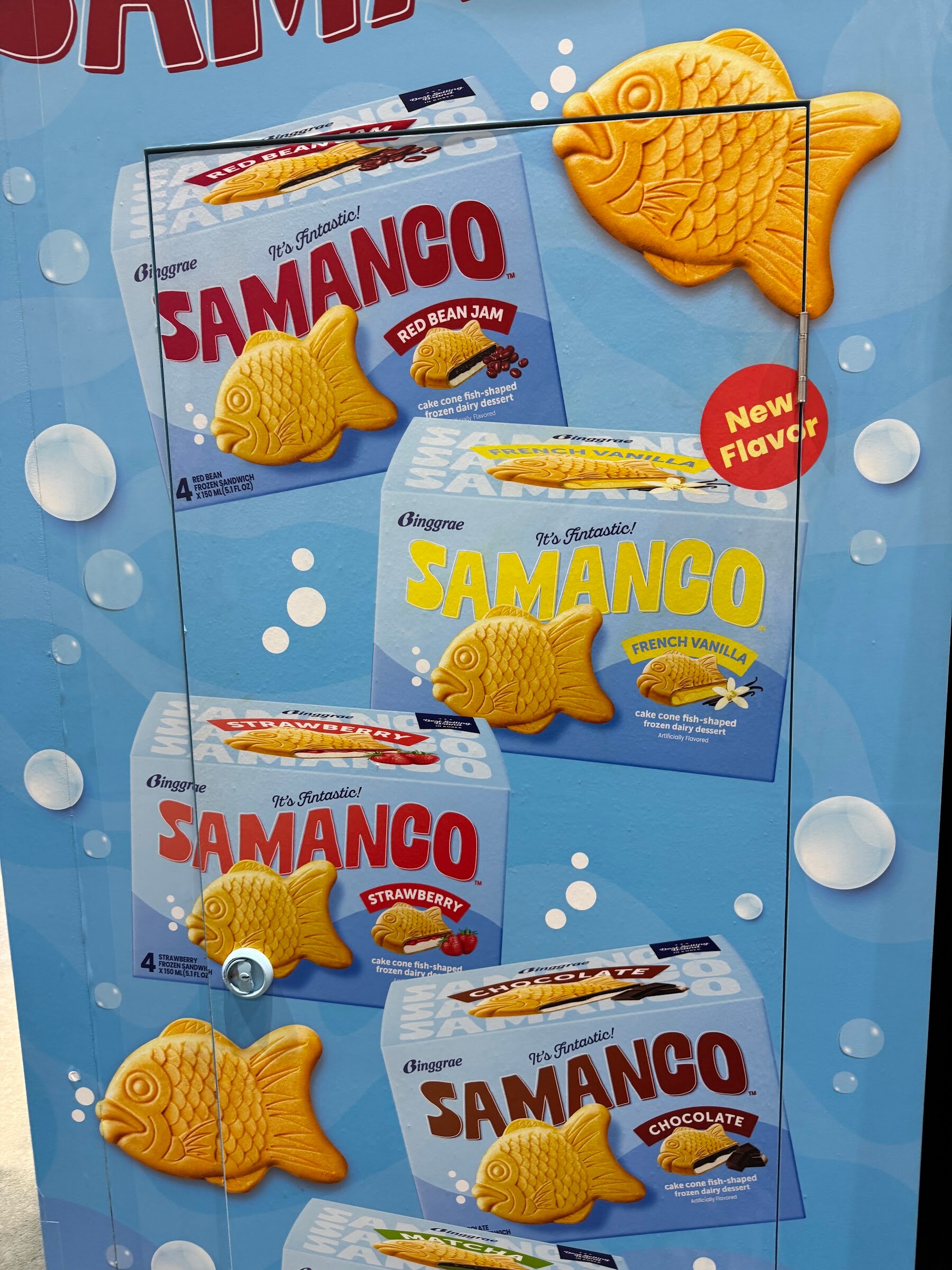 Freezer door display of Samanco fish-shaped ice cream sandwich boxes in red bean, mango and chocolate.
