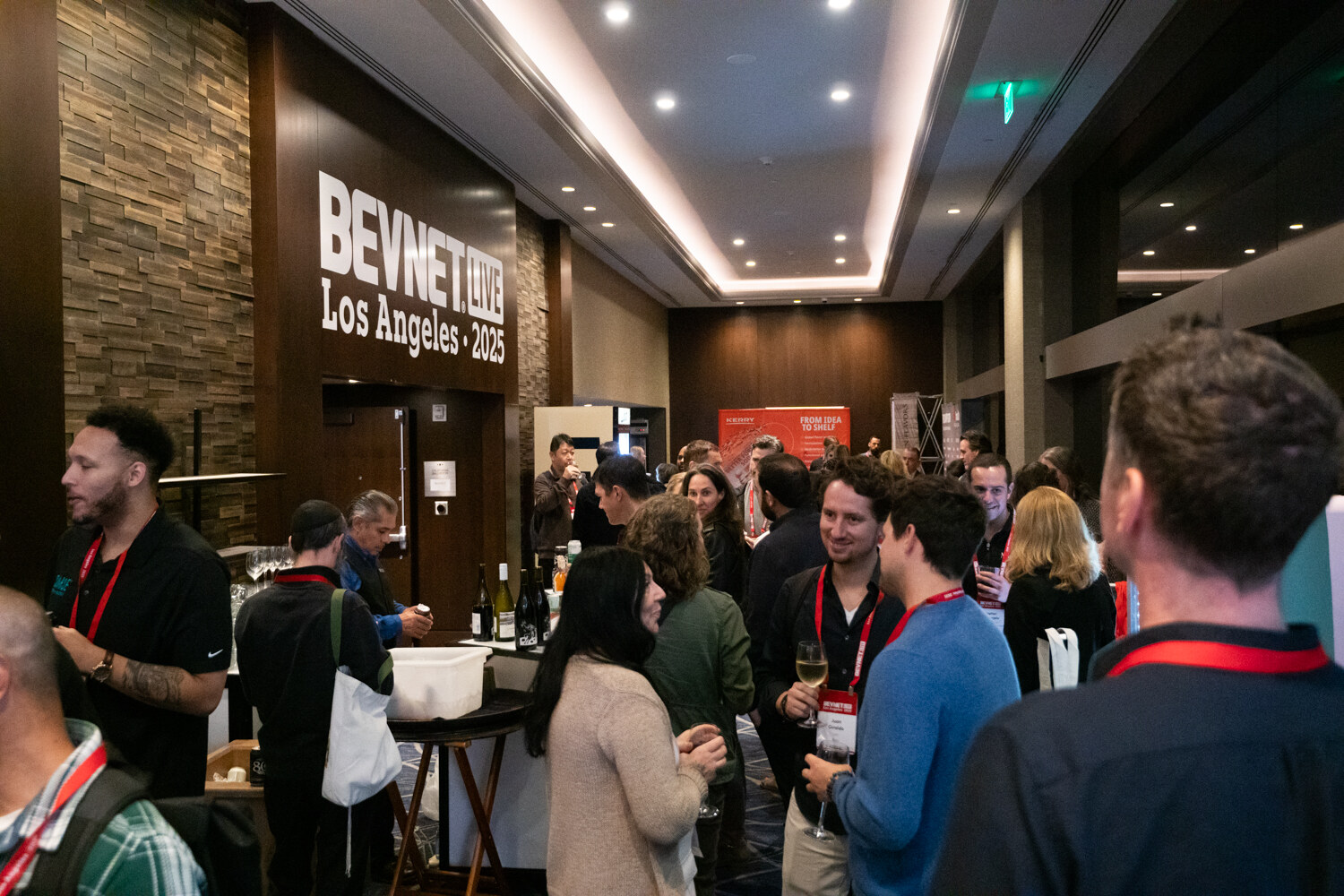 Attendees gather under the lit BevNET Live Los Angeles 2025 sign.