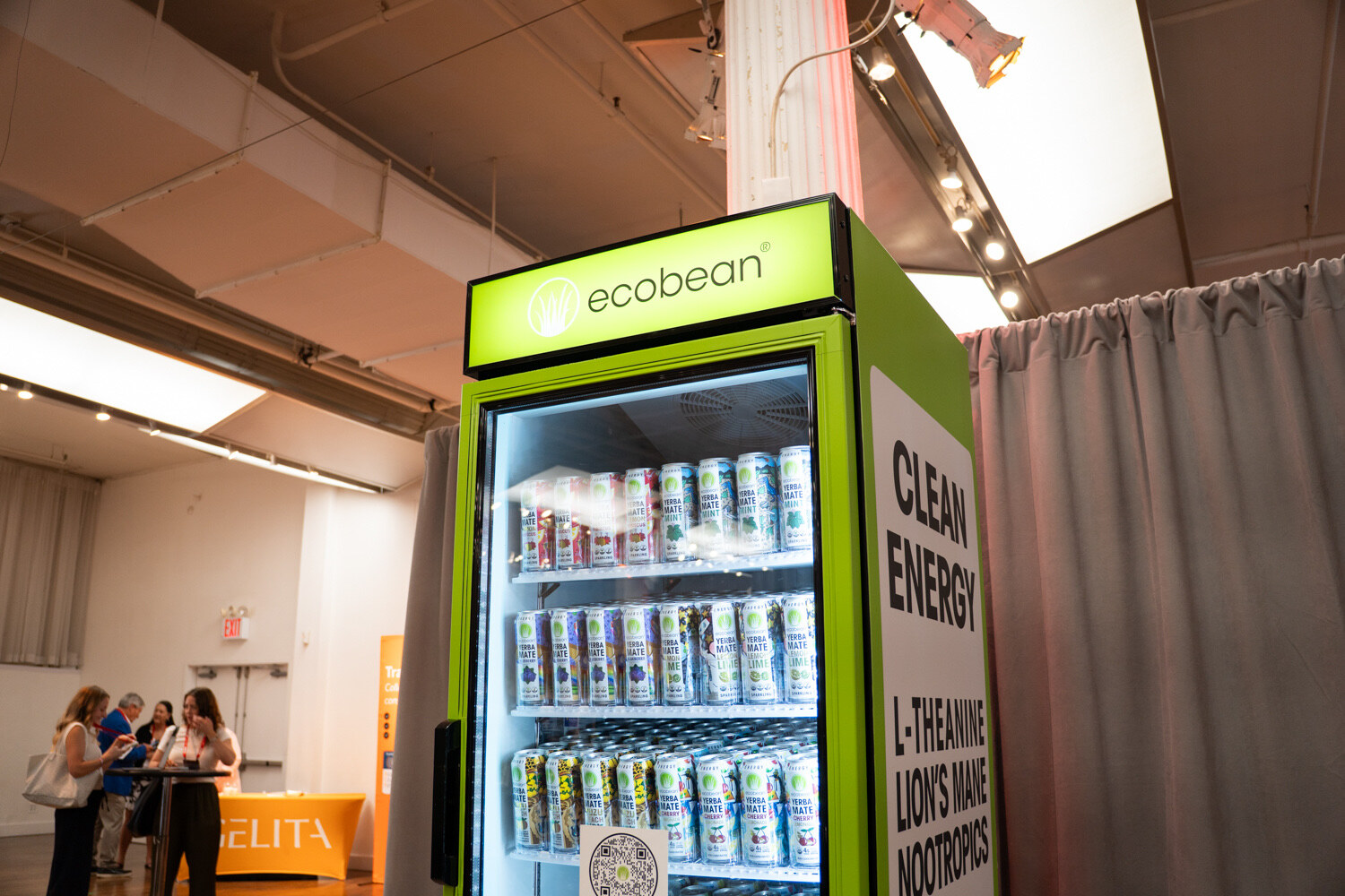 A lime green ecobean fridge full of cans with a side panel reading "Clean Energy."