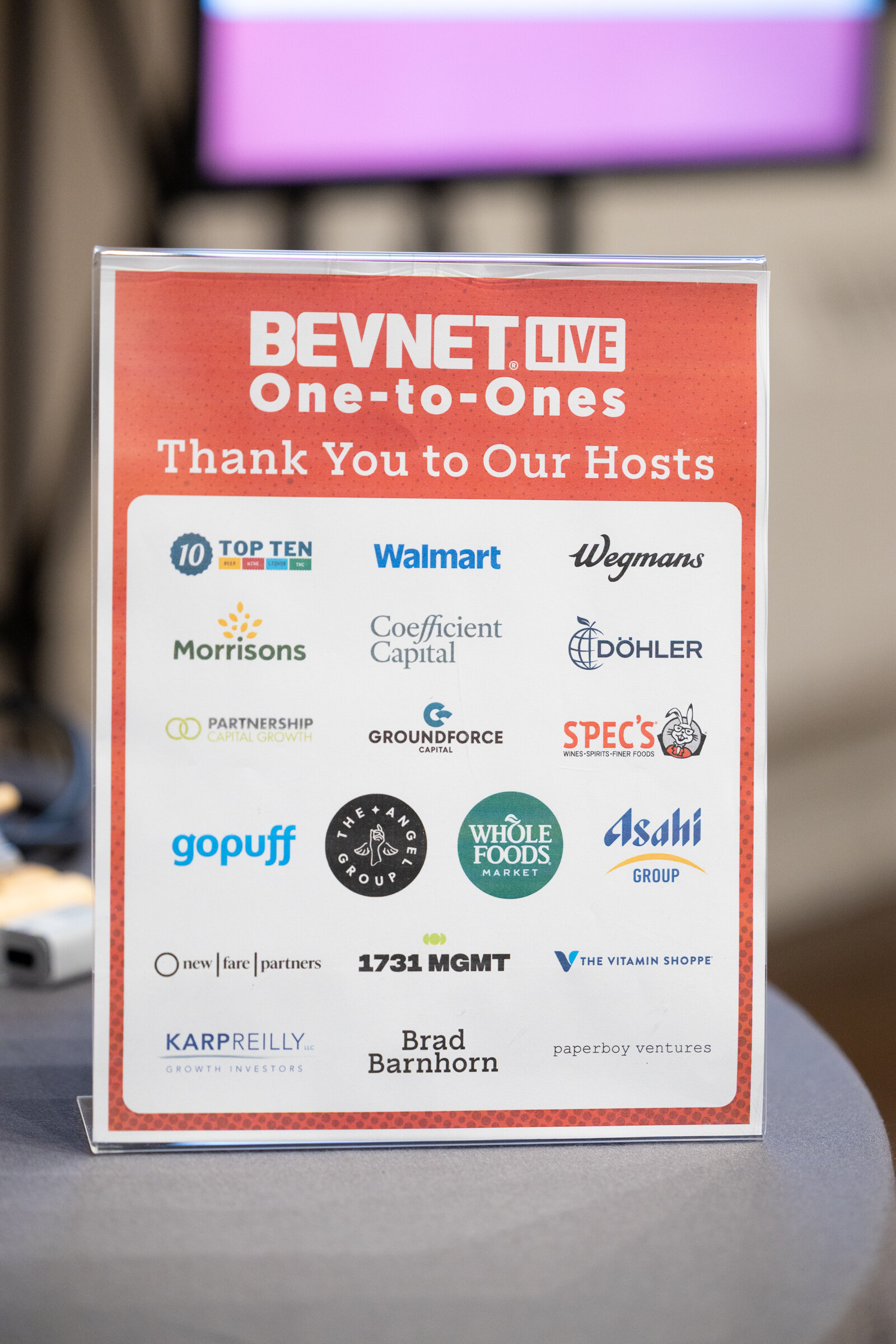Table sign reading BevNET Live One-to-Ones, Thank You to Our Hosts, with retailer and investor logos.