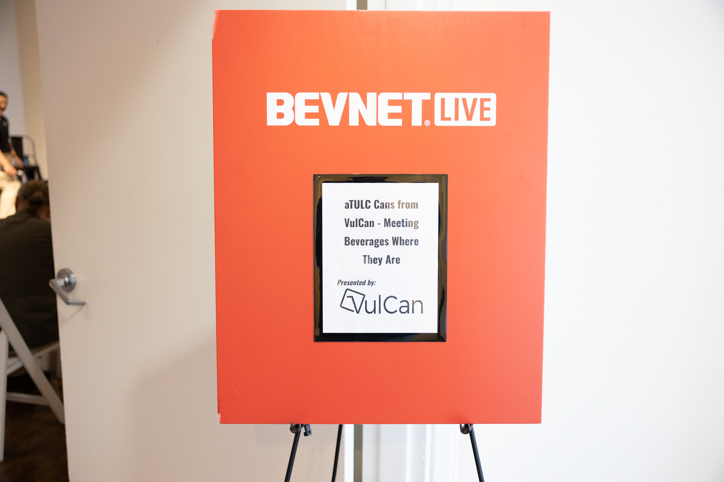 Red BevNET Live easel sign with the VulCan workshop title.