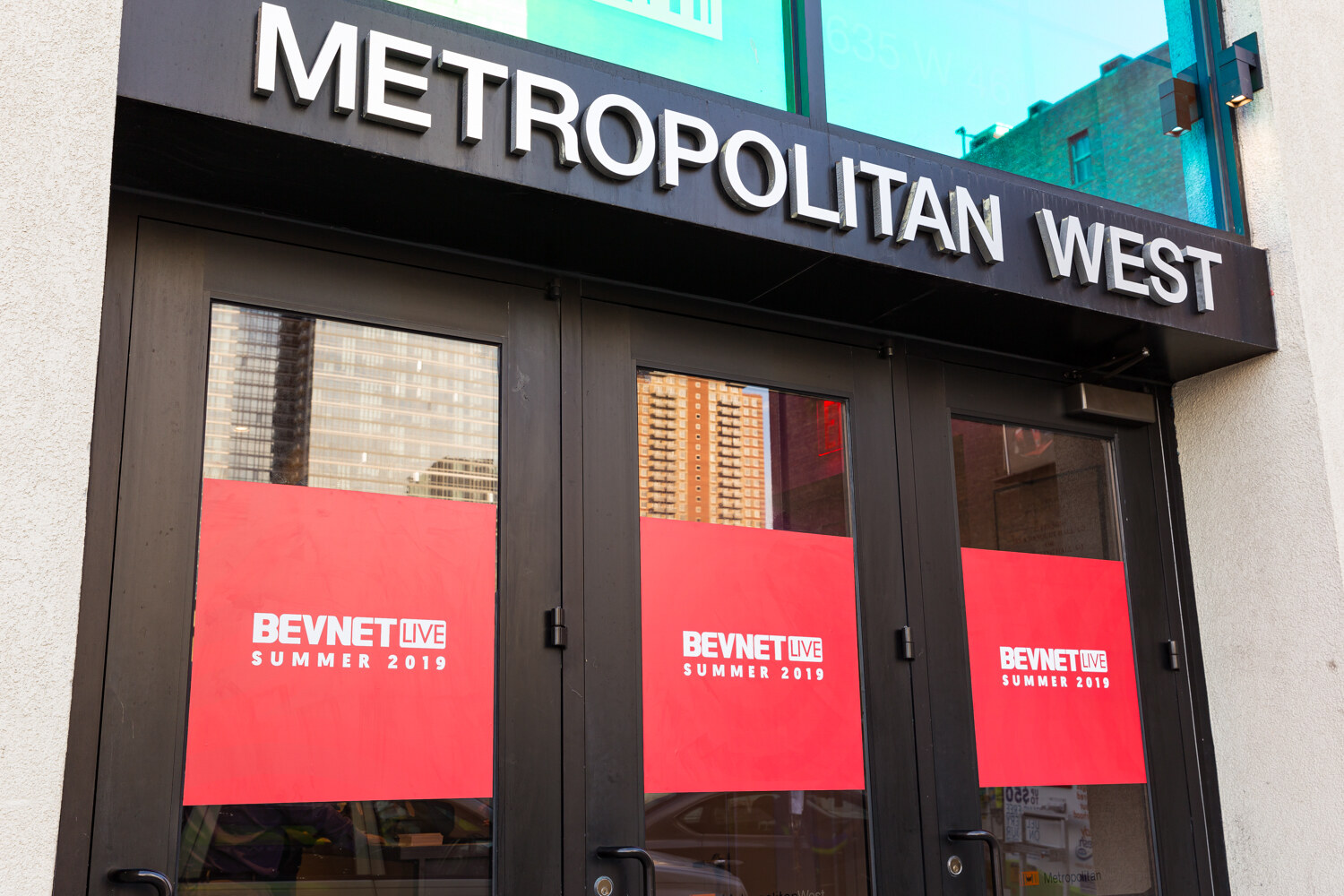 Metropolitan West entrance with BevNET Live Summer 2019 window graphics.