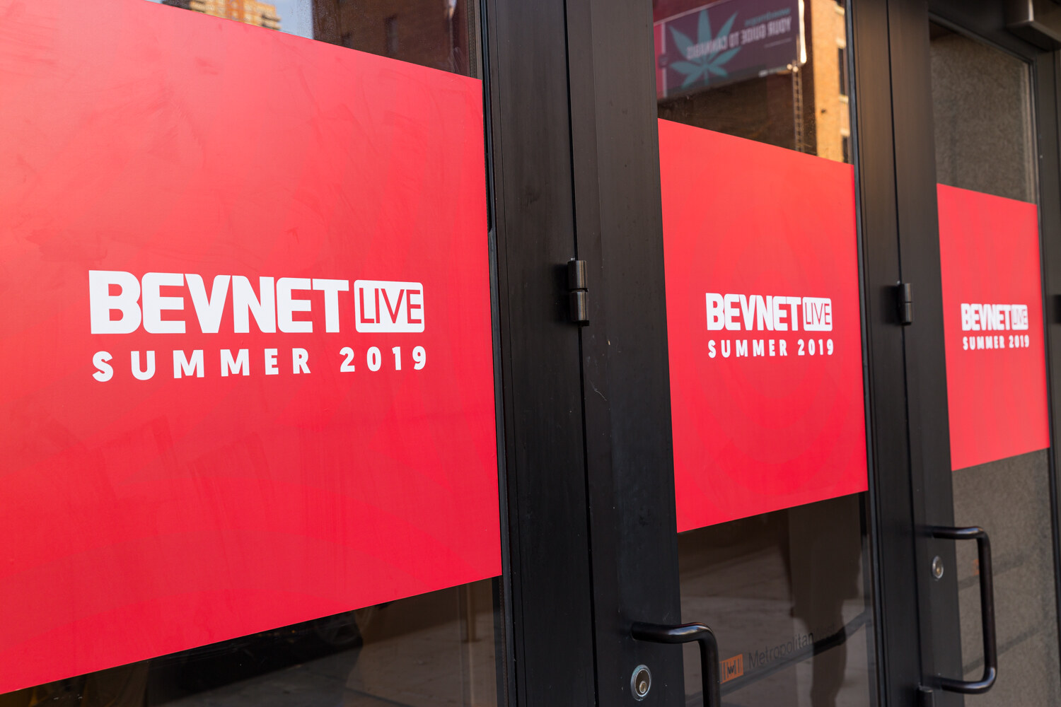 Red BevNET Live Summer 2019 graphics on the Metropolitan West doors.