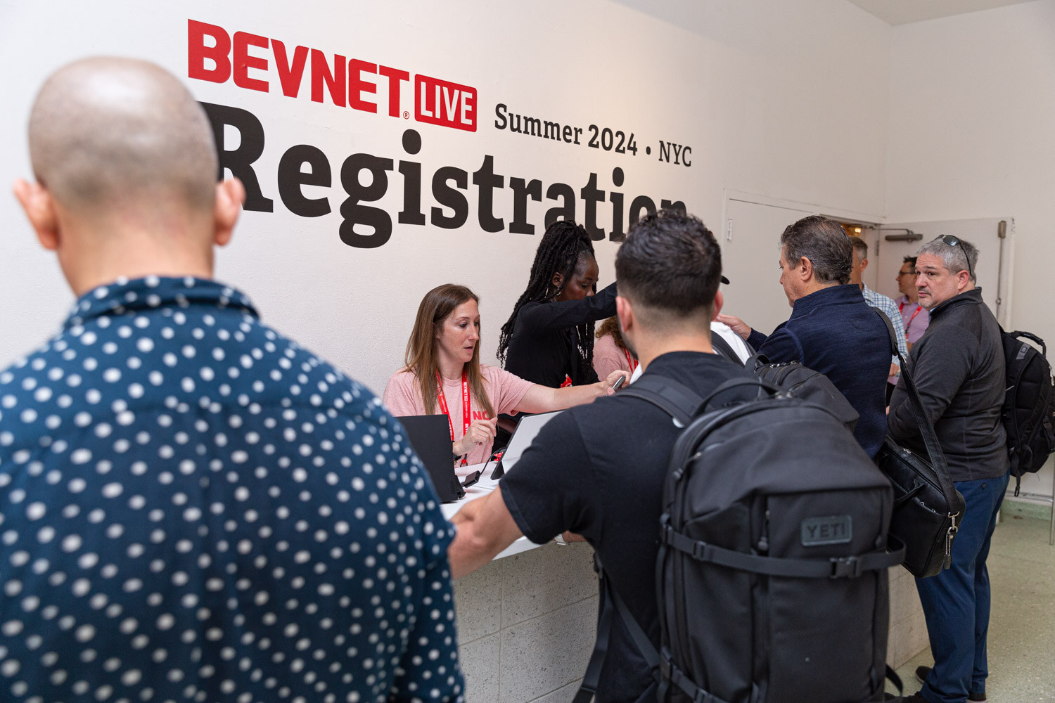 Attendees check in at the BevNET Live Summer 2024 registration desk.