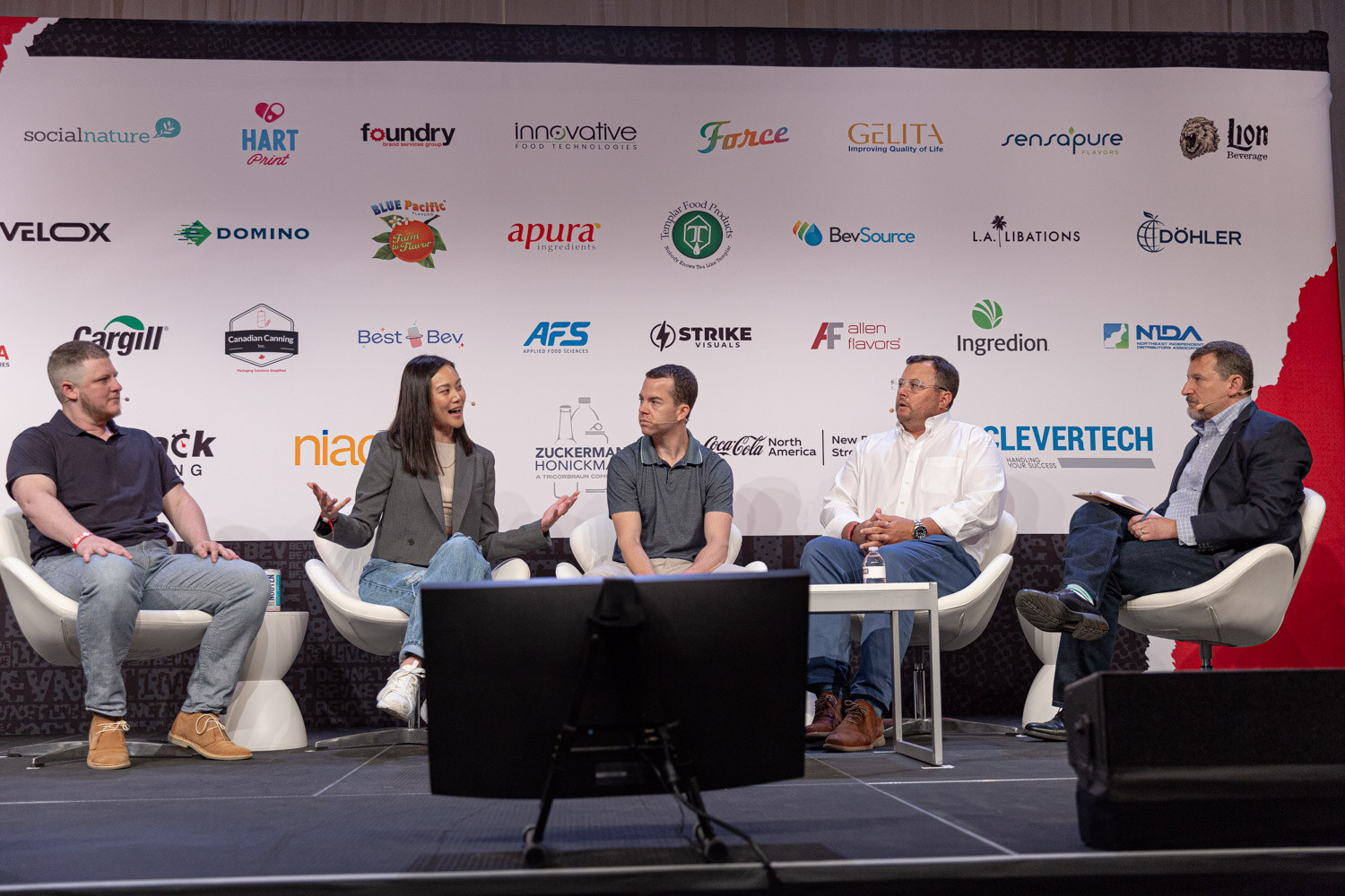 Wide view of the State of the Market panel on the main stage.