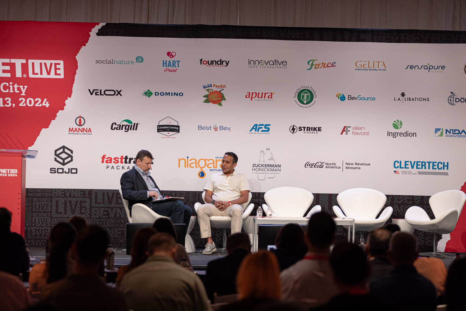Wide view of the Finance session on the main stage with the audience in front.