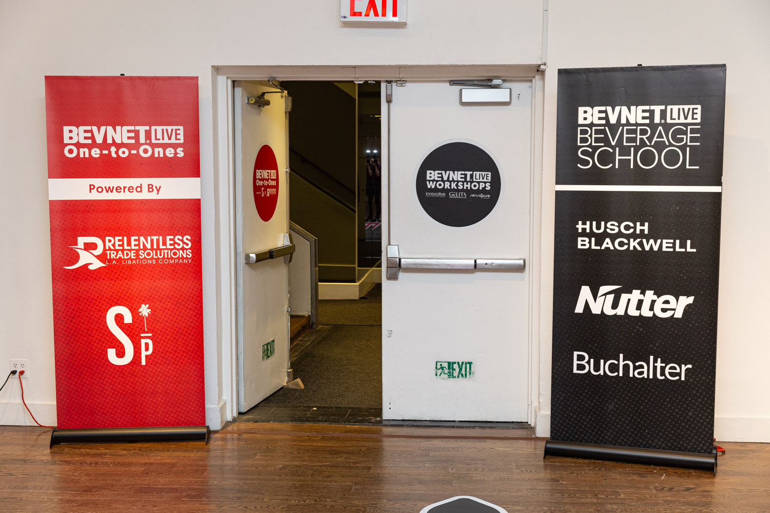 One-to-Ones and Beverage School banners outside the meeting rooms.