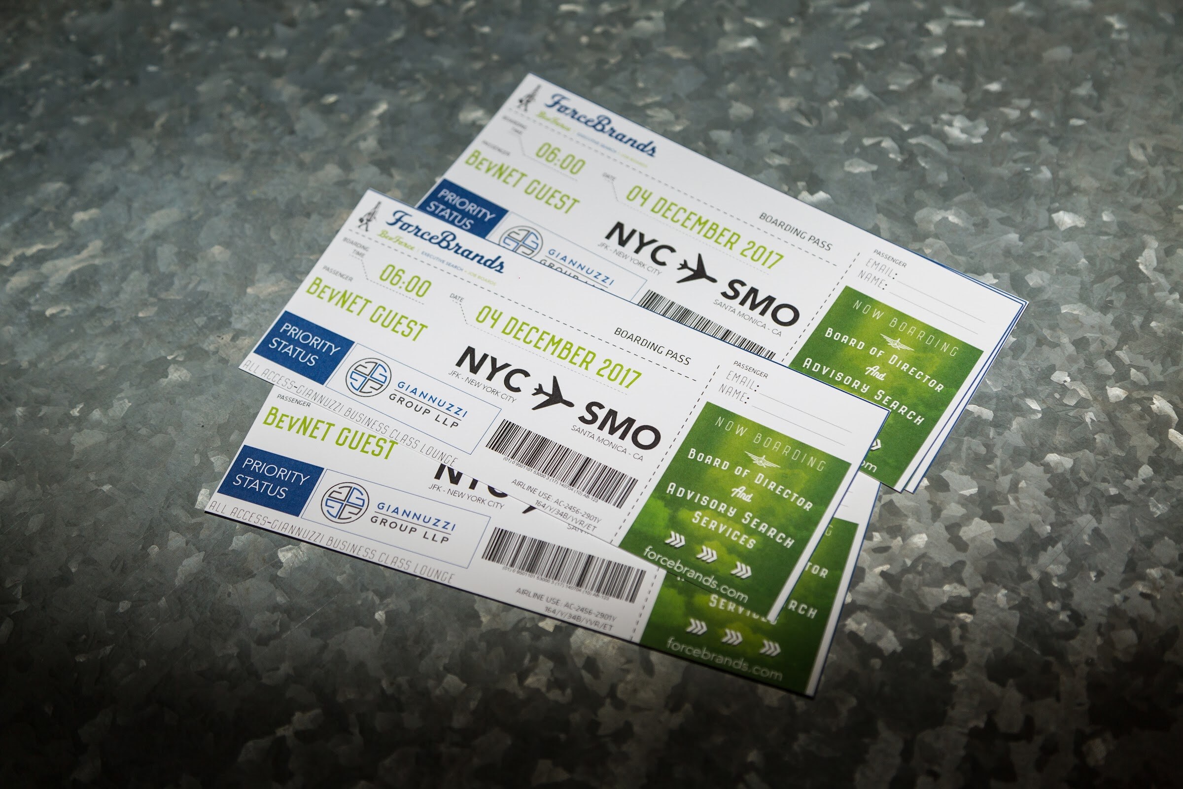 A stack of boarding-pass style tickets reading ForceBrands, BevNET Guest, NYC to SMO, 04 December 2017, with a Giannuzzi Group Business Class Lounge logo, on a galvanized metal surface.