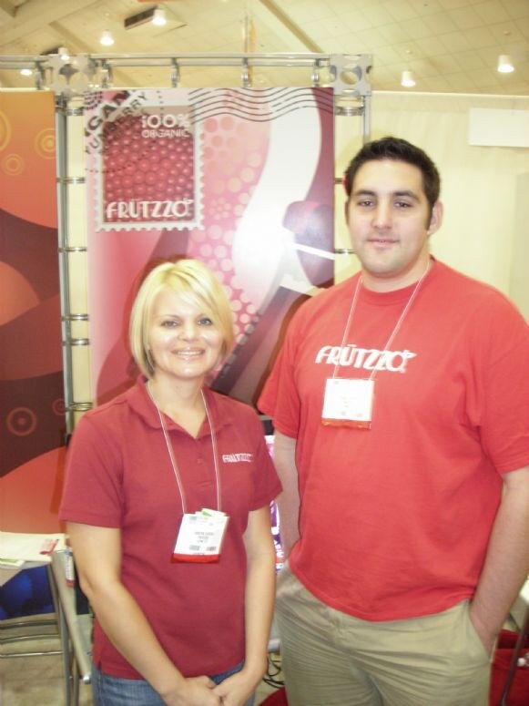 Kristen and Stelios of Frutzzo at the Frutzzo exhibit at Expo East 2007.