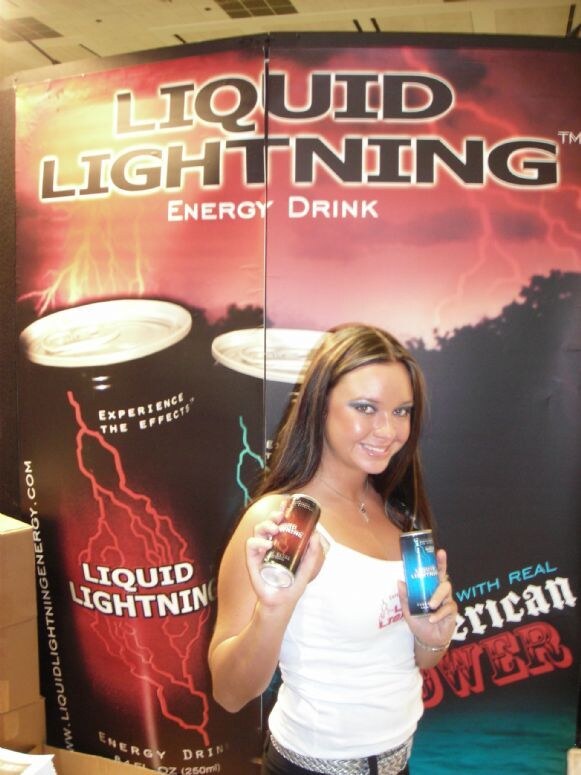 Monica of Liquid Lightning at the Liquid Lightning display at Expo East 2007. The photo is unavailable, so this is based on the listed name, brand and event.