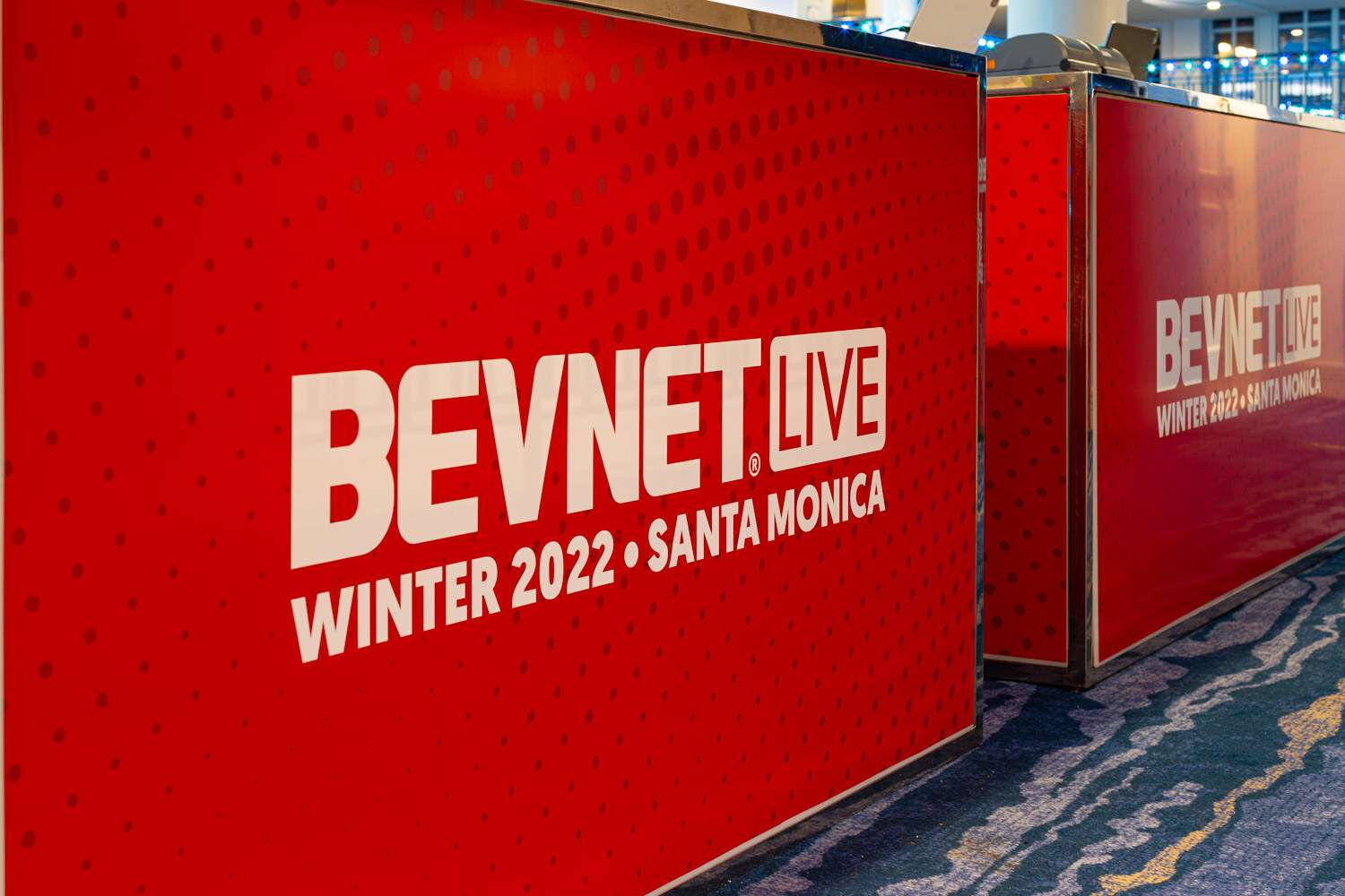 A red counter with large white lettering reading BevNET Live Winter 2022 Santa Monica.