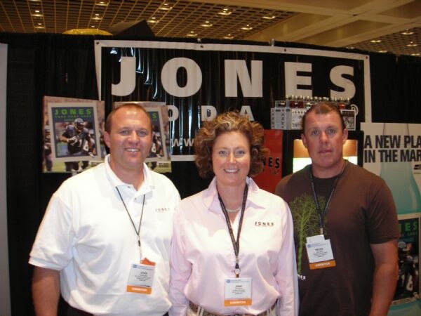 Chad Kennedy, Erin Knight and Peter Burns of Jones Soda at the Jones Soda exhibit at NBWA 2007. The photo is unavailable, so this is based on the listed people, brand and event.