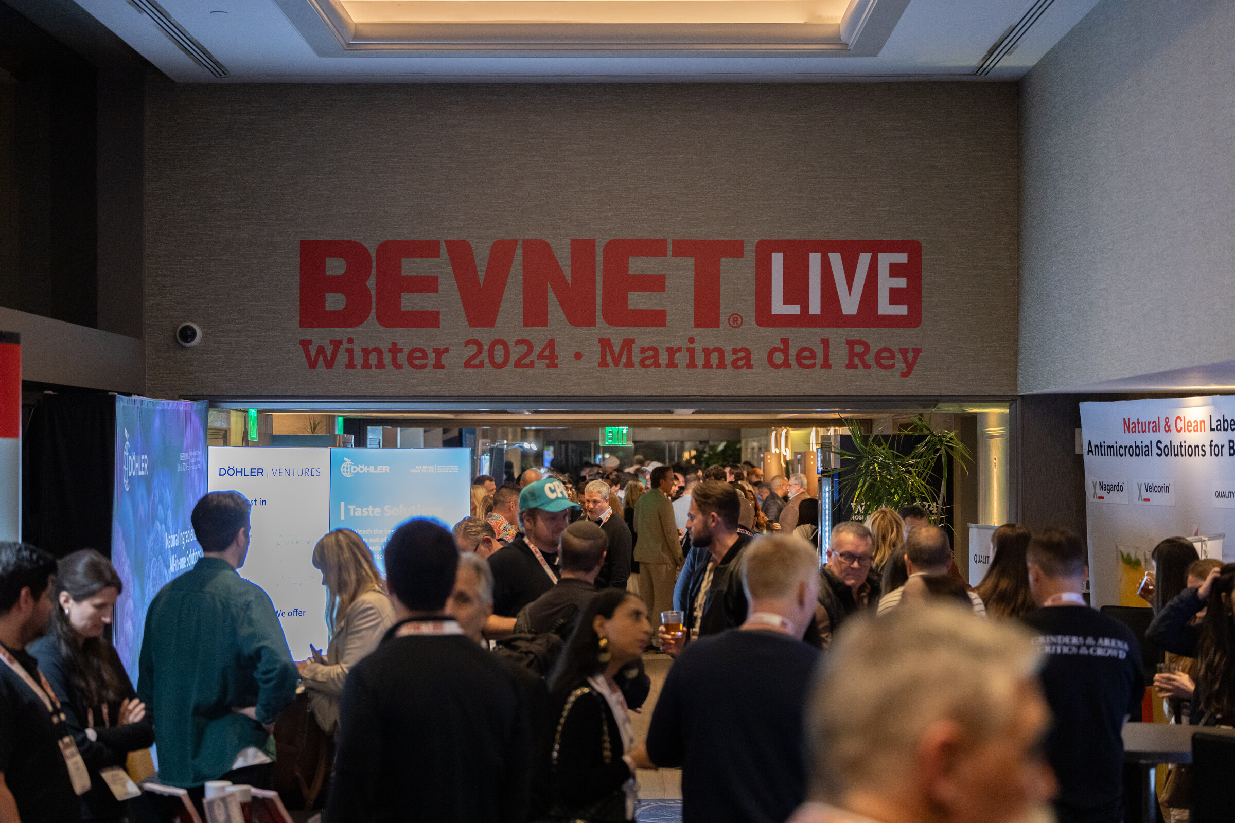 Crowd in a hallway under a sign reading BevNET Live Winter 2024 Marina del Rey.