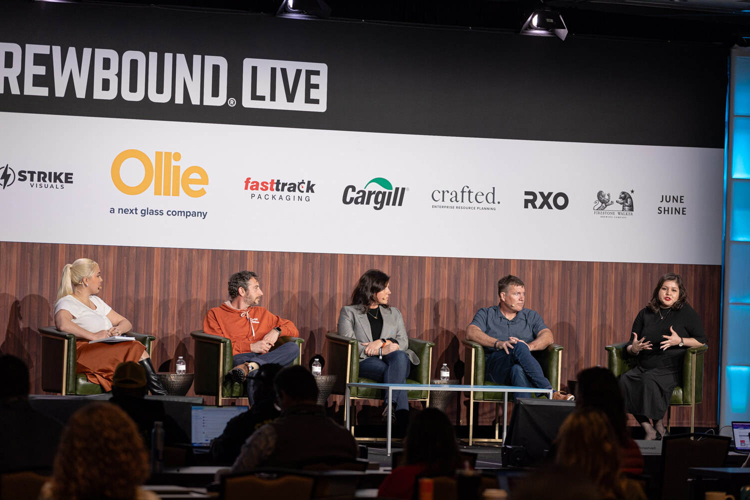Five people sit on a stage under the Brewbound Live banner with audience members' heads visible in the foreground.