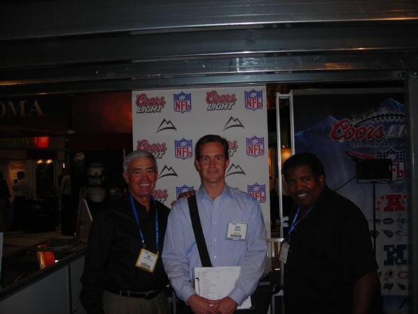 Jim Mora and Dennis Greene in a photo related to Coors at NACS 2007. The image is unavailable, so no further visual detail can be given.