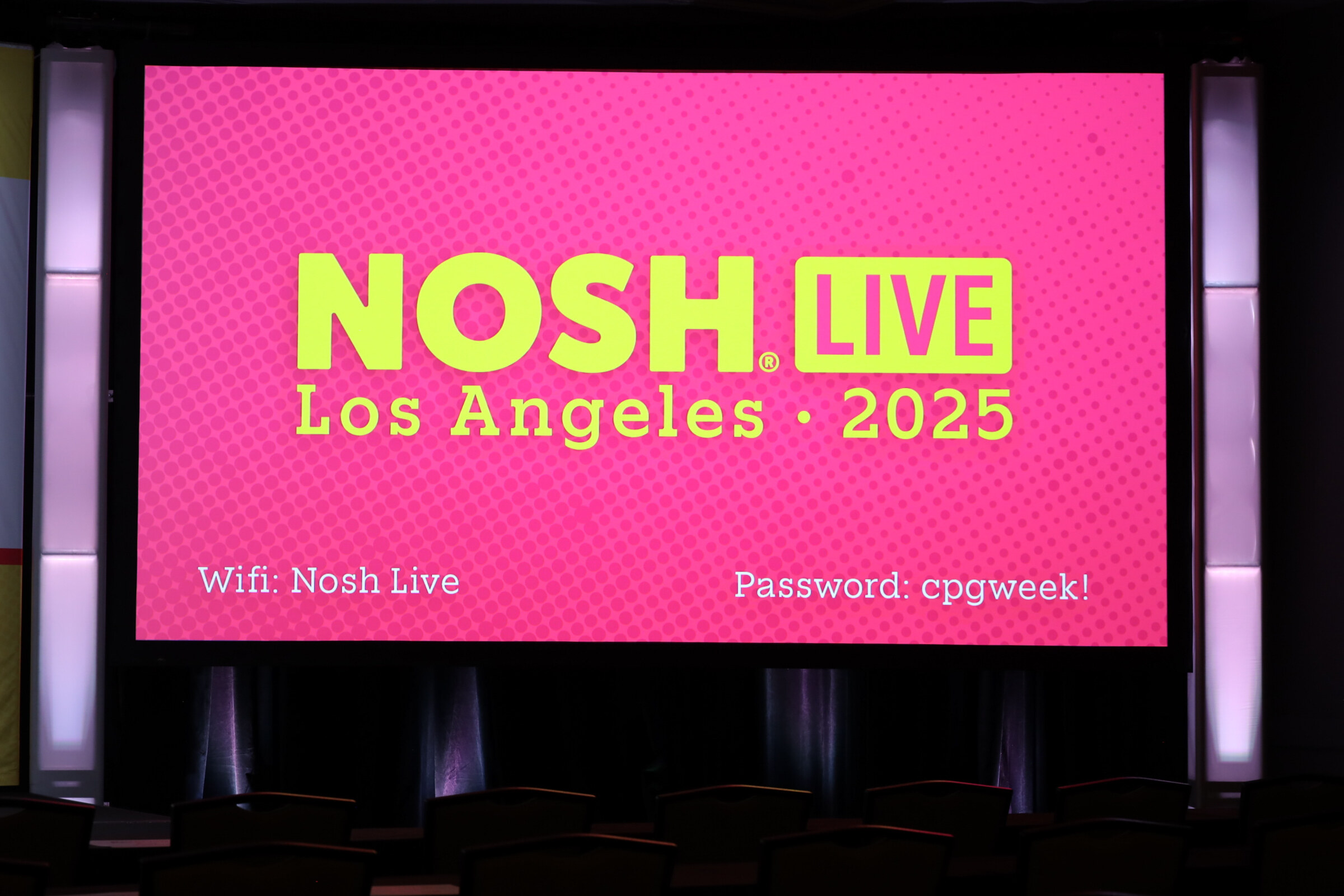 A large pink screen reading Nosh Live Los Angeles 2025 with Wi-Fi information.