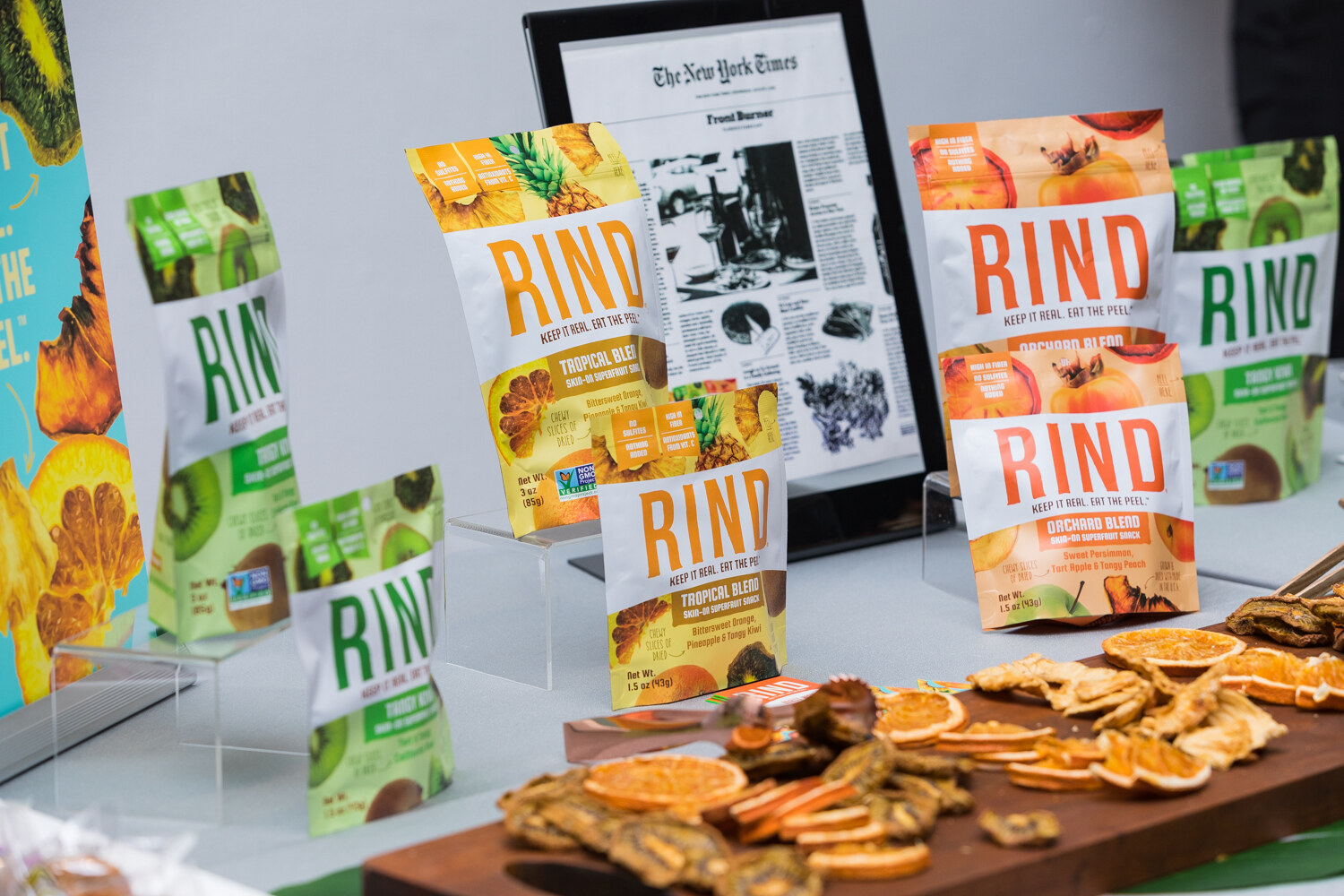 RIND dried fruit pouches with a board of dried fruit slices