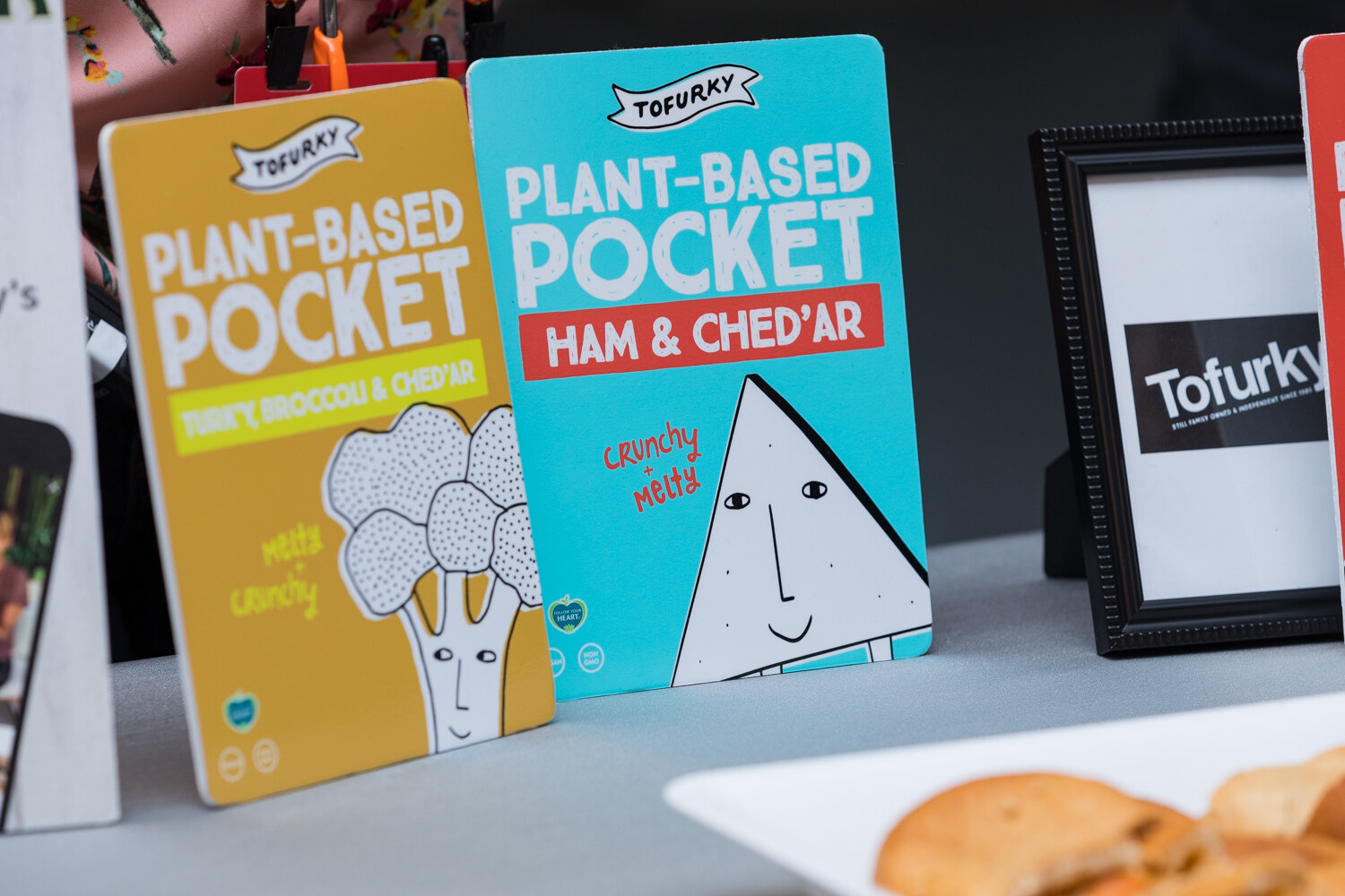 Tofurky plant-based pocket cards beside a tray of baked samples