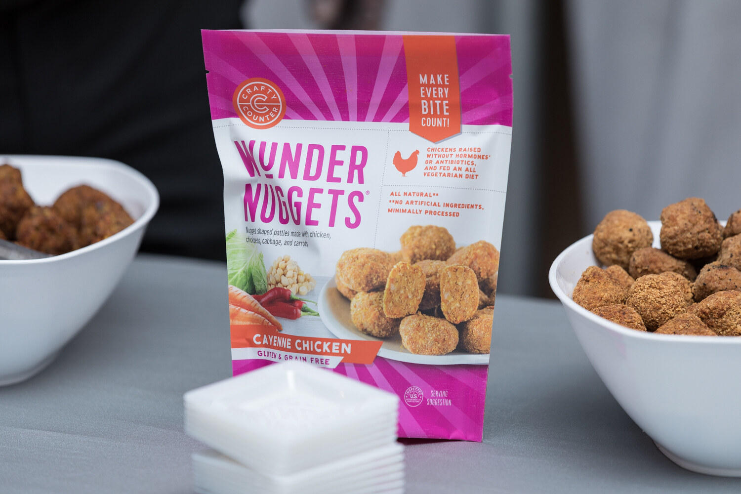 Wunder Nuggets pouch beside bowls of nugget samples