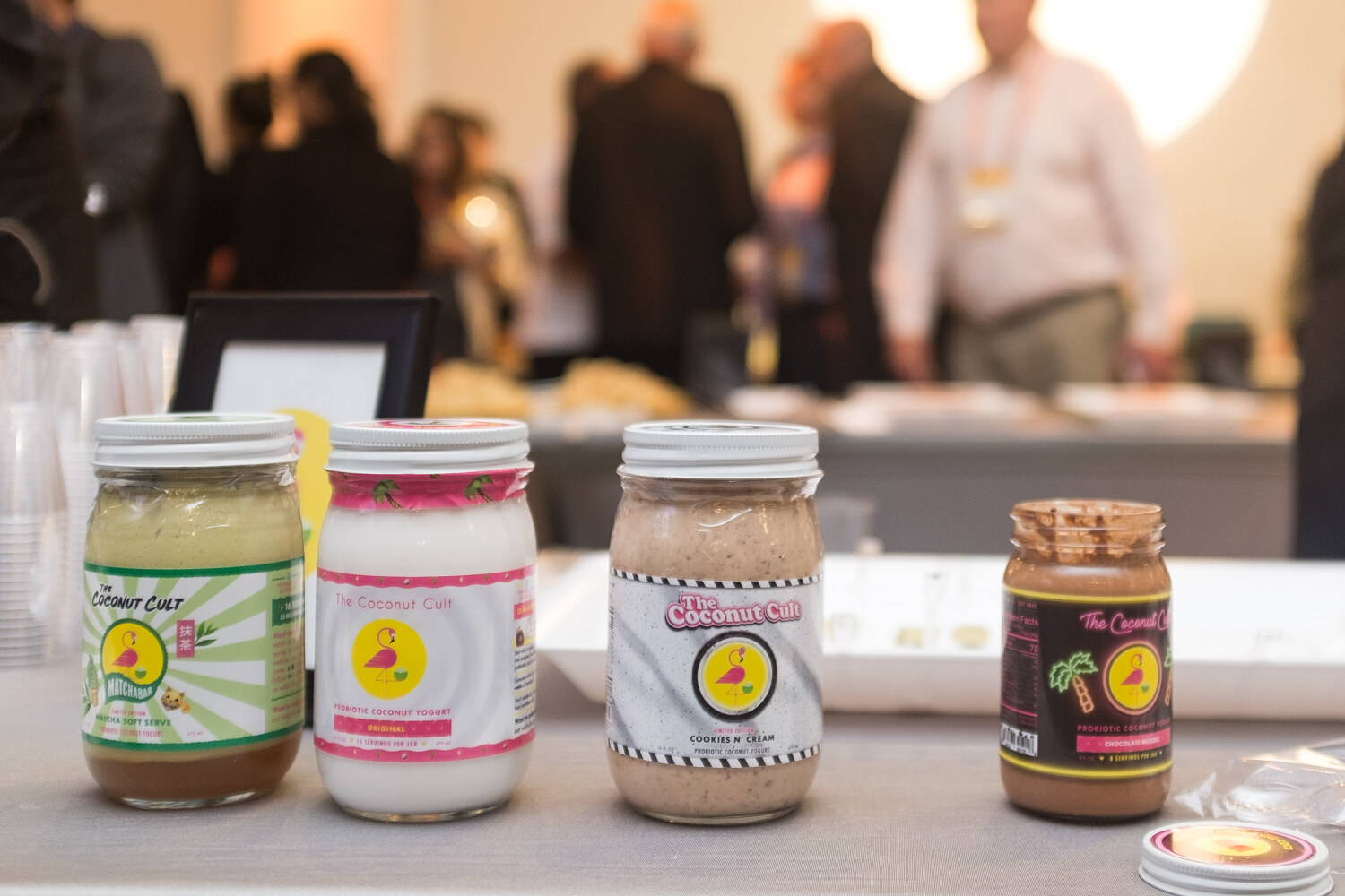 The Coconut Cult jars of coconut yogurt on a sampling table