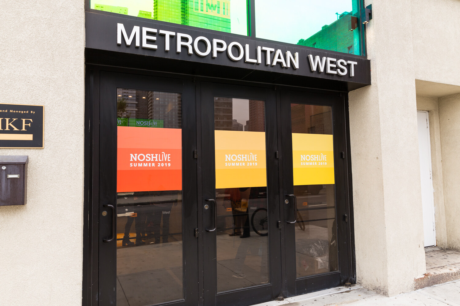 Metropolitan West entrance with NOSHLIVE Summer 2019 window graphics