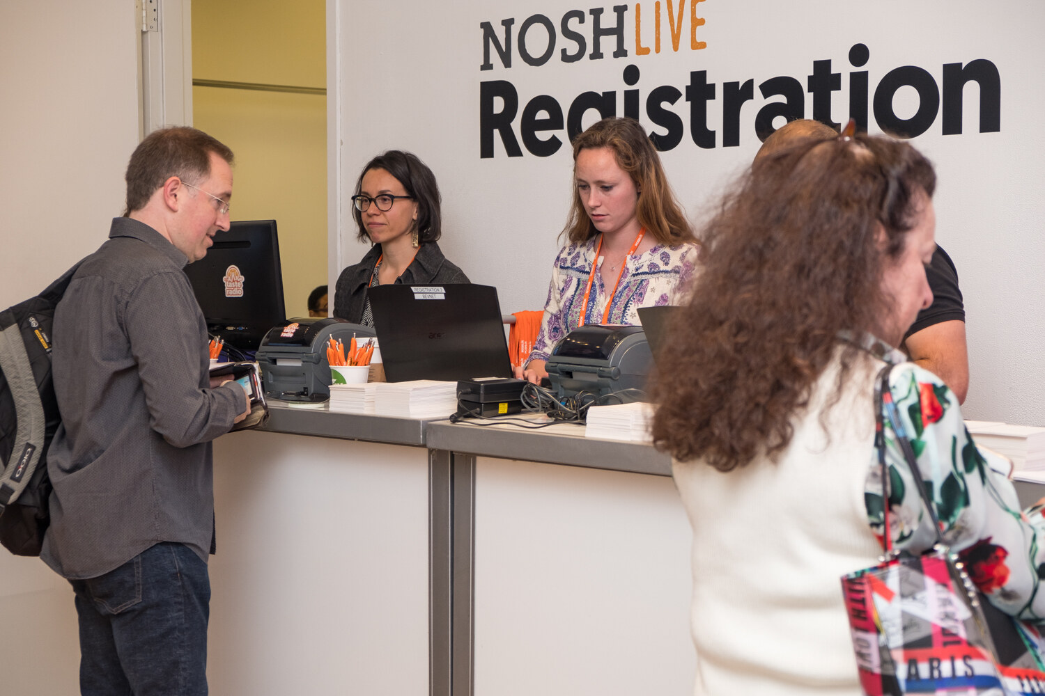 Attendees checking in at the NOSH LIVE registration desk