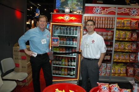 Bruce Burke, Co-Founder, CEO and President, and Brett Cody, Director, Public Relations, proudly show their new Firefighter Brand of beverages