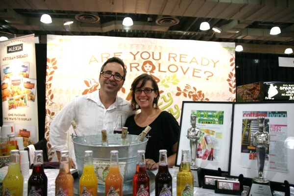 Aaron Morrill of Fizzy Lizzy at the Fizzy Lizzy booth at NY Fancy Food 2008, with one additional unnamed person.