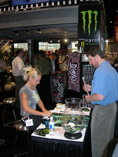Monster Energy's calender girl was busy signing posters of herself.