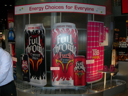 A display under a sign reading 'Energy Choices for Everyone' shows oversized Full Throttle, Full Throttle Fury and Tab Energy cans, with smaller cans in front.
