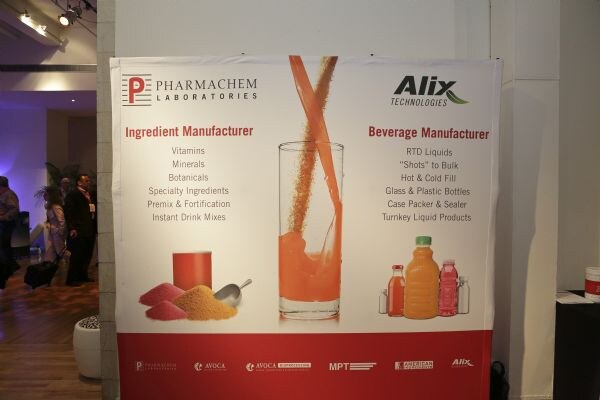 A banner for Pharmachem Laboratories as ingredient manufacturer and Alix Technologies as beverage manufacturer, with a glass of orange drink, powders and bottles pictured.
