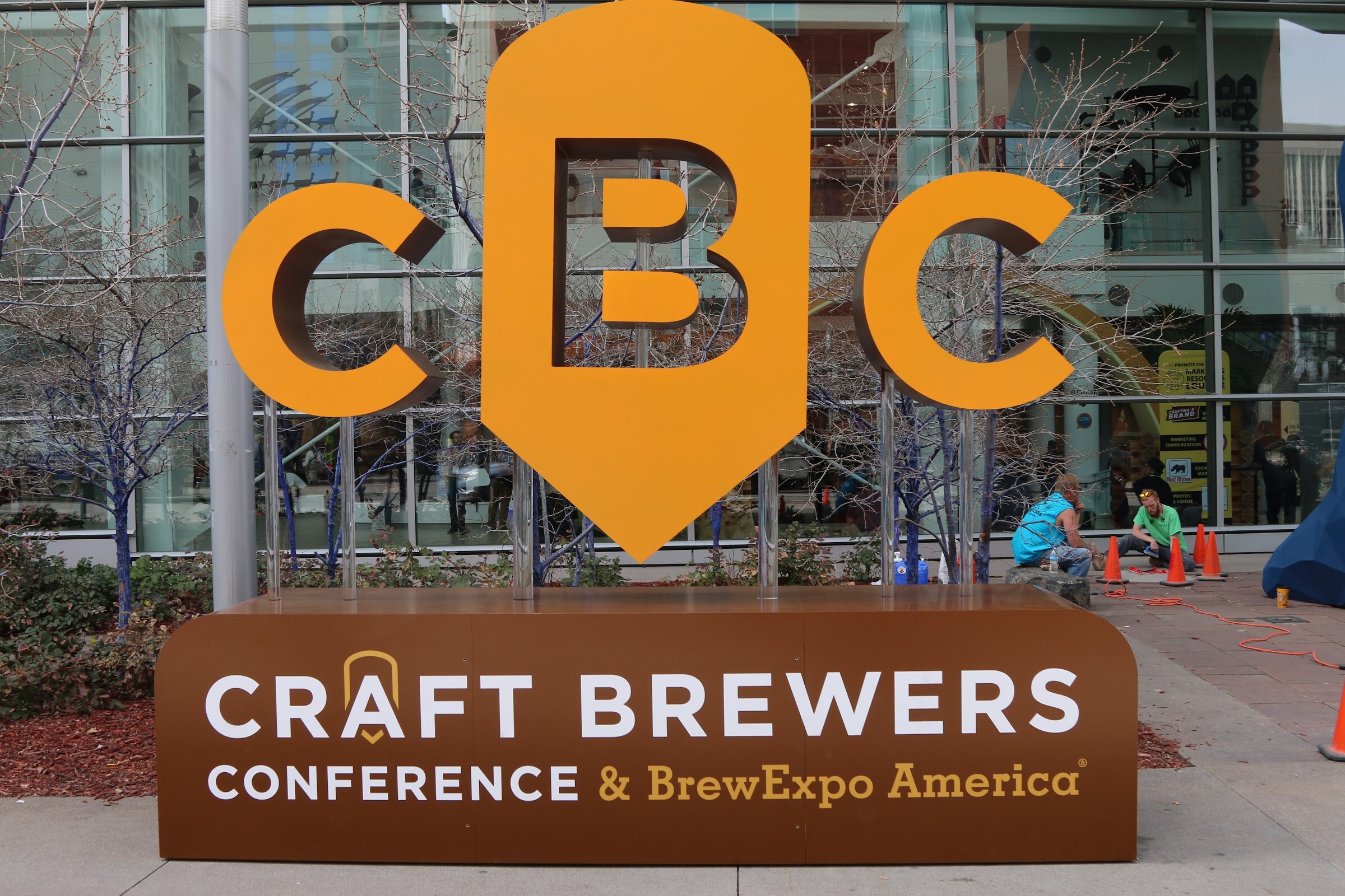 A large orange CBC logo sign above the words Craft Brewers Conference and BrewExpo America.